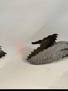 Hand-Carved Hen Decorative Carving signed and dated 1993: Hand-carved and painted wooden decoy of a Canvasback hen, featuring tight feather detail with soft gray, brown, and black tones. Signed and dated underneath.Part of the American Wildlife Collection by