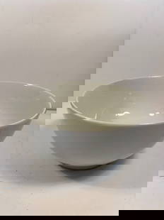 A Chinese Blanc de Chine porcelain bowl: Late 19th century to early 20th century. The foot rim has firing residue and age-toning. Height: 9.75 inches; Diameter: 5 inches.