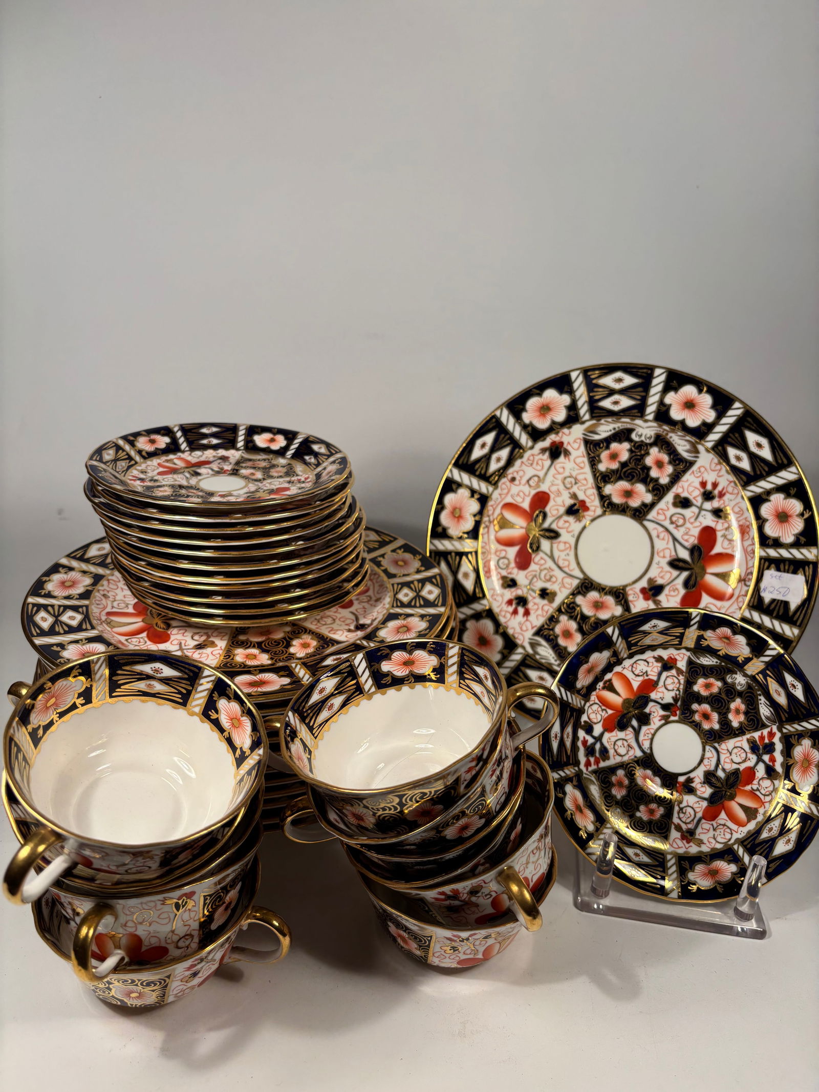 36 Pieces Royal Crown Derby 'Imari' (2451) Pattern porcelain Service, Late 19th/20th Century: comprising 36 pieces: 12 tea cups,12 saucers , 12 salad plates; A 36-piece porcelain tea and dessert service by Royal Crown Derby in the iconic “Old Imari” pattern No. 2451. Each piece is fine