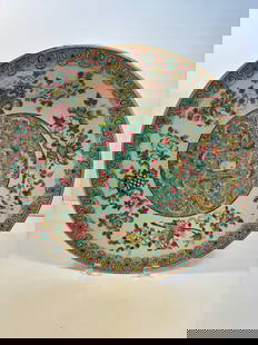 A Super large Chinese famille rose porcelain charger: Late 19th to early 20th, the central features a beautiful scrolling lotus or peony design with a central longevity peach, The band around the rim uses a common “ruyi head&rdquo; pattern. Diameter: 1