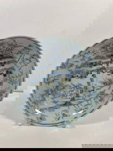 A Chinese blue and white porcelain plate with "Chenghua" six character mark: Qing Dynasty (1644-1912); Kangxi Period; It features the scene features deer, pine trees, and scrolls. Diameter: 8 inches ; Height: 1.75 inches