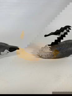 Wildfowler Decoys Canada Goose Carving, Babylon NY,: A hand-carved and painted decorative Canada Goose decoy by Wildfowler Decoys, Babylon, New York. The body features carved wing and feather detail, with painted surface in natural tones. Stamped on the