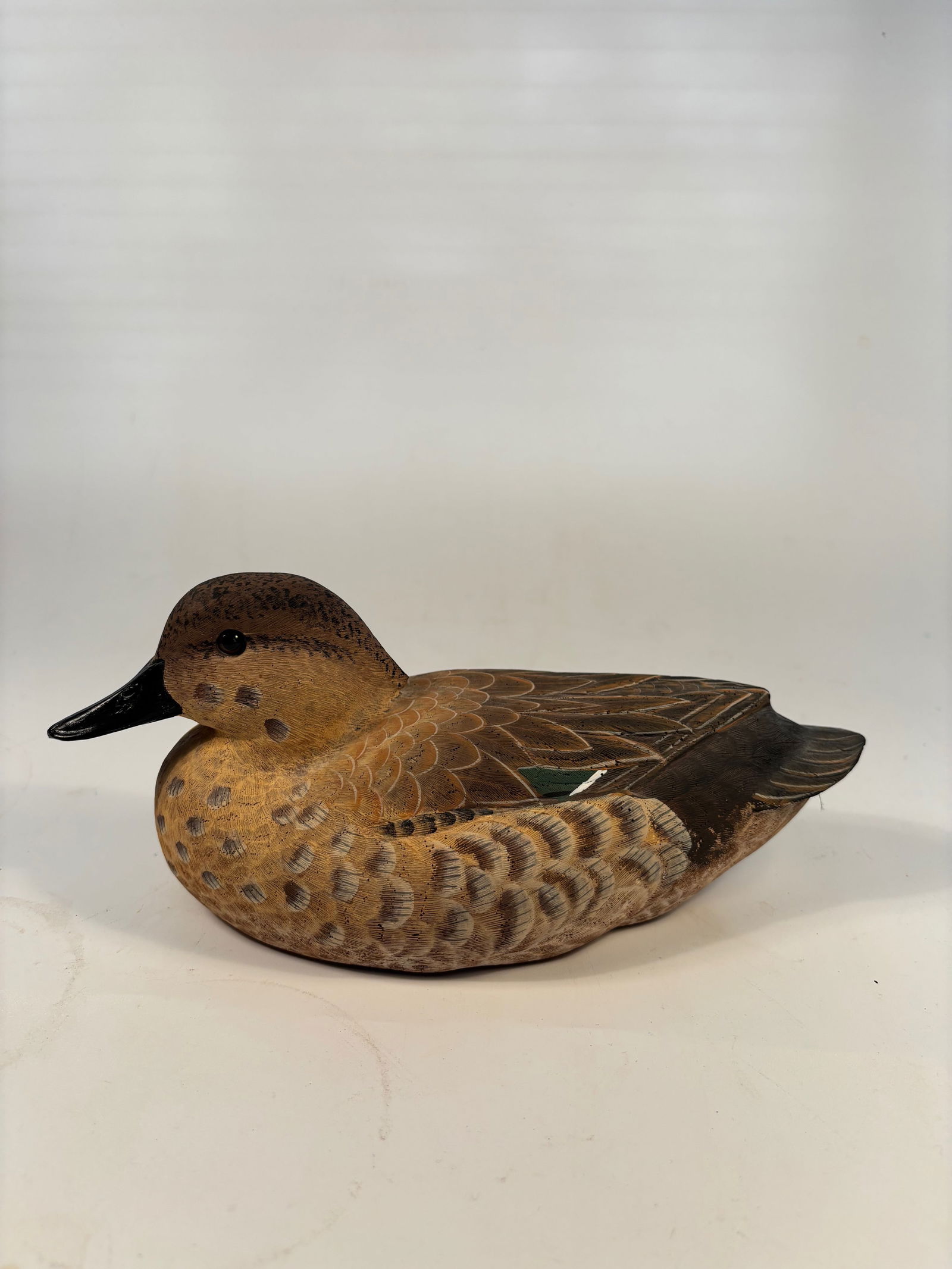 Green-Wing Teal Hen Decorative Carving by R. Thomas, 1991: Realistically hand-carved and painted wooden model of a Green-Wing Teal hen, signed on the base: “Green Wing Teal Hen by R. Thomas 3-28-91”. Part of the American Wildlife Collection by Craft-T