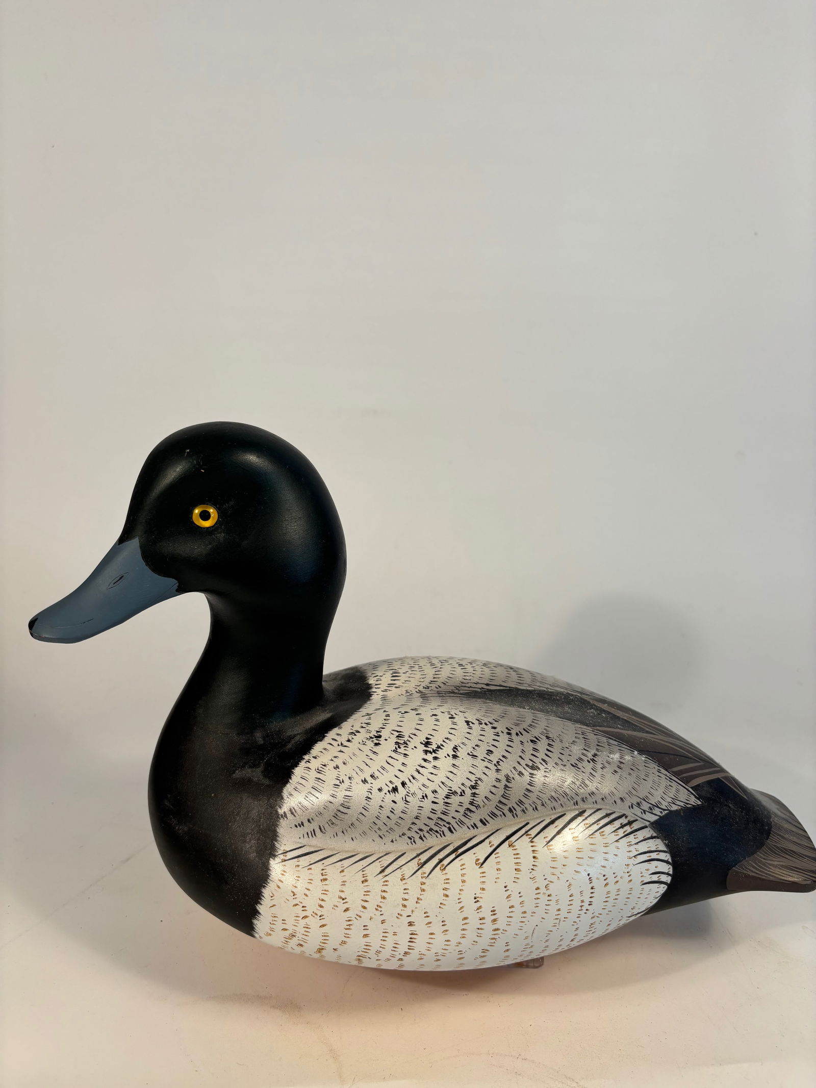 Decorative Scaup Drake Decoy Signed by Randy Tull: Hand-carved and painted scaup drake decoy by noted contemporary artist Randy Tull. Features finely detailed vermiculation, stylized geometric feather painting on the back, and lifelike carving through