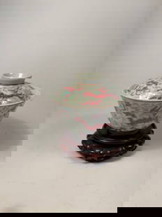 A Chinese Famille Rose Porcelain Dragon Bowl with Cover with "QIANLONG" mark: Qing dynasty(1644-1912); Finely enamelled in the famille rose palette, the bowl and its matching domed cover are both decorated with five-clawed imperial dragons in vibrant iron-red, emerald green, an