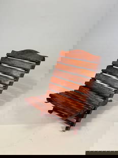 A Miniature Chinese Huanghuali/ rosewood Folding Chair, Scholar’s Model: A miniature Chinese-style folding lounge chair, finely crafted from richly grained hardwood, likely huanghuali or similar dense tropical wood. The chair features slatted construction with a gently arc