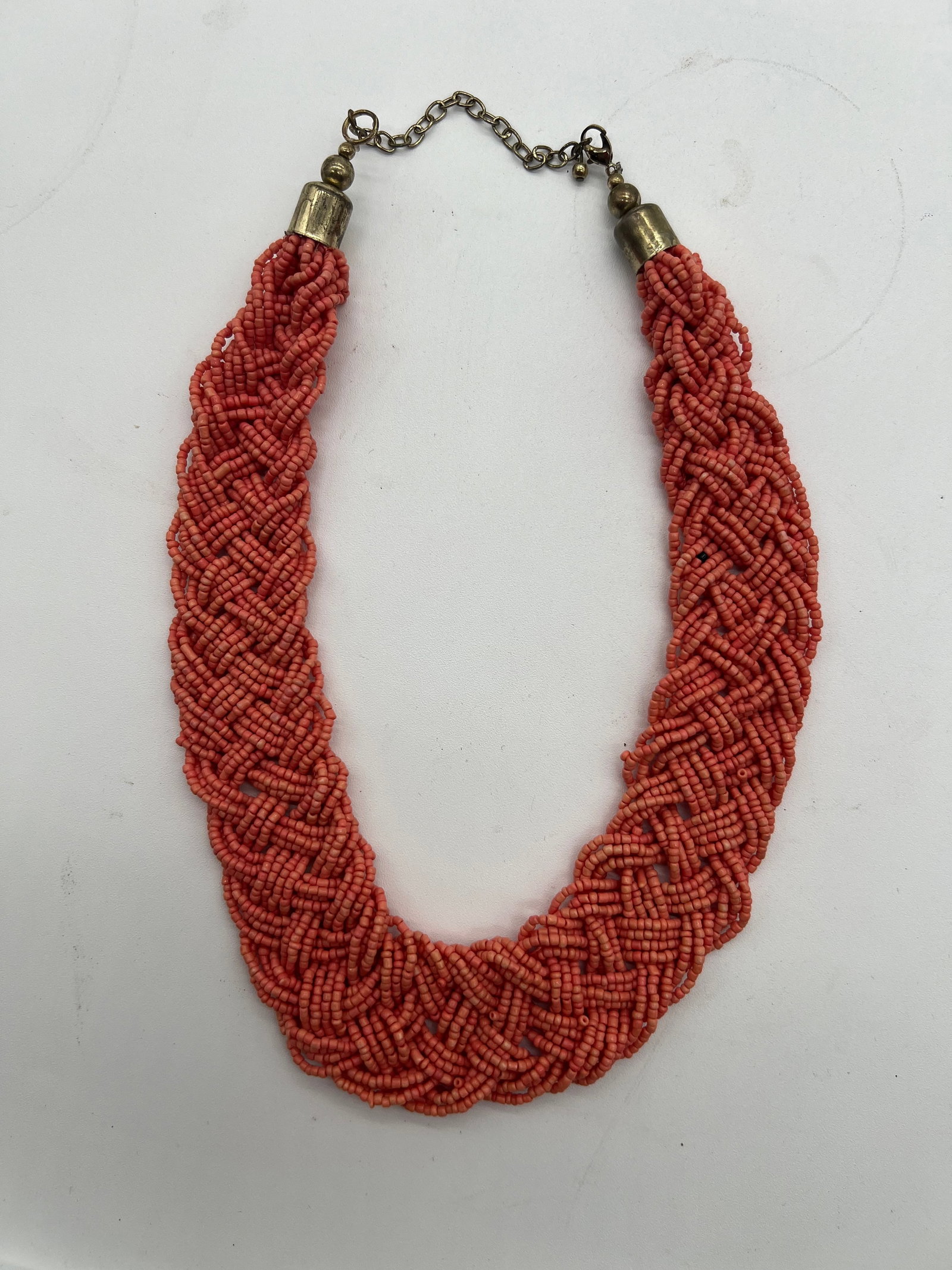 A multi-strand beaded necklace with coral beads (1 of 5)