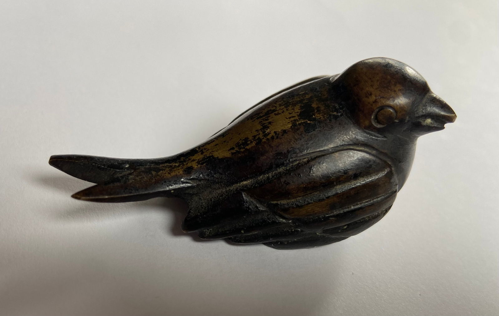 A Chinese gilt bronze bird sculpture: 19th Century; likely a paperweight, Scholar's object; Dimensions?Length: 2.6 inches