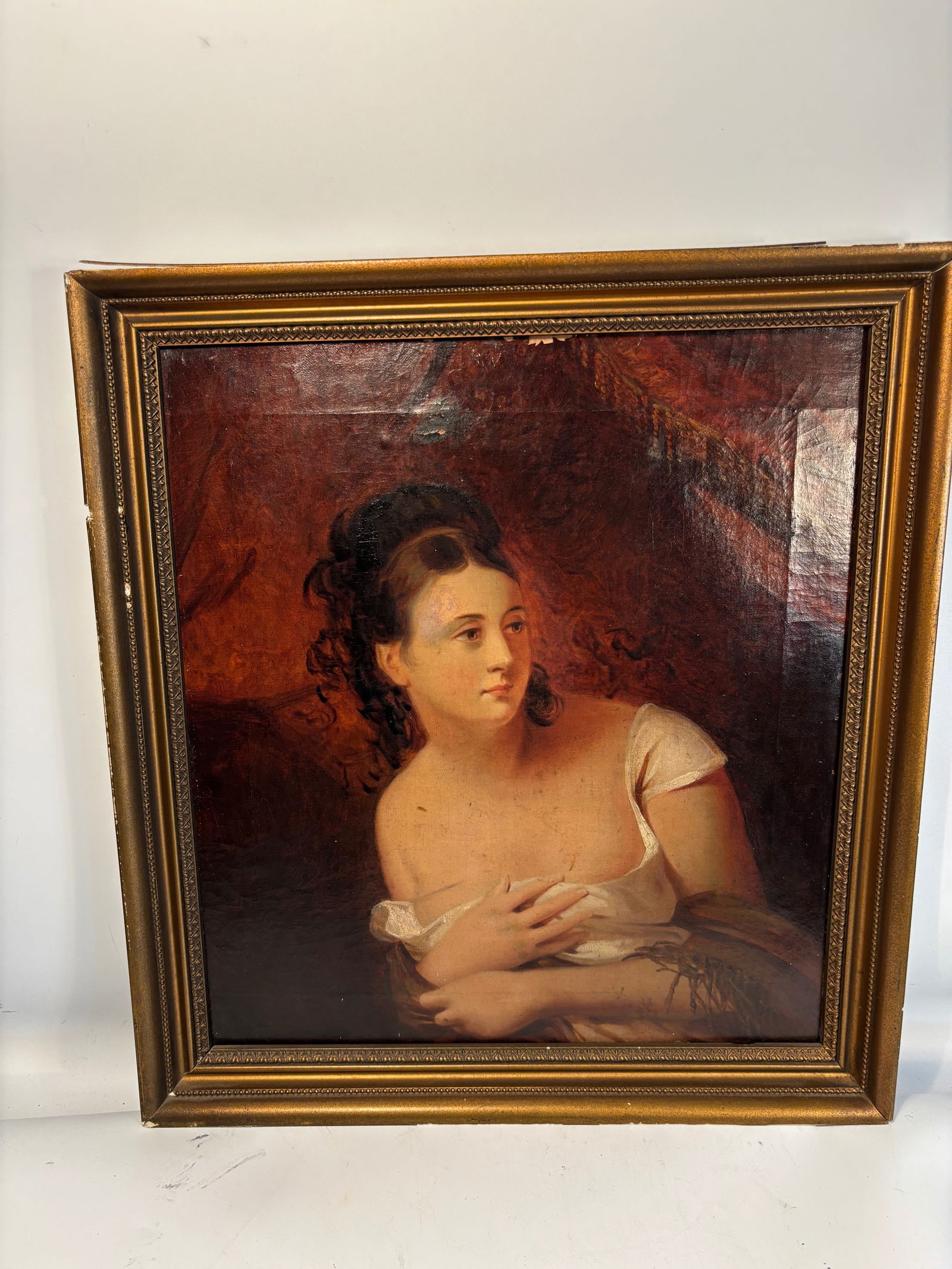 Attributed to Claude-Marie Dubufe (1790–1864), ‘The Surprise,’ Portrait of a Young Woman, Oil: A refined 19th-century oil painting portraying a young woman in a seated, contemplative pose, her bare shoulder softly draped in white fabric. The sitter’s upward hairstyle, crossed arms, and romant