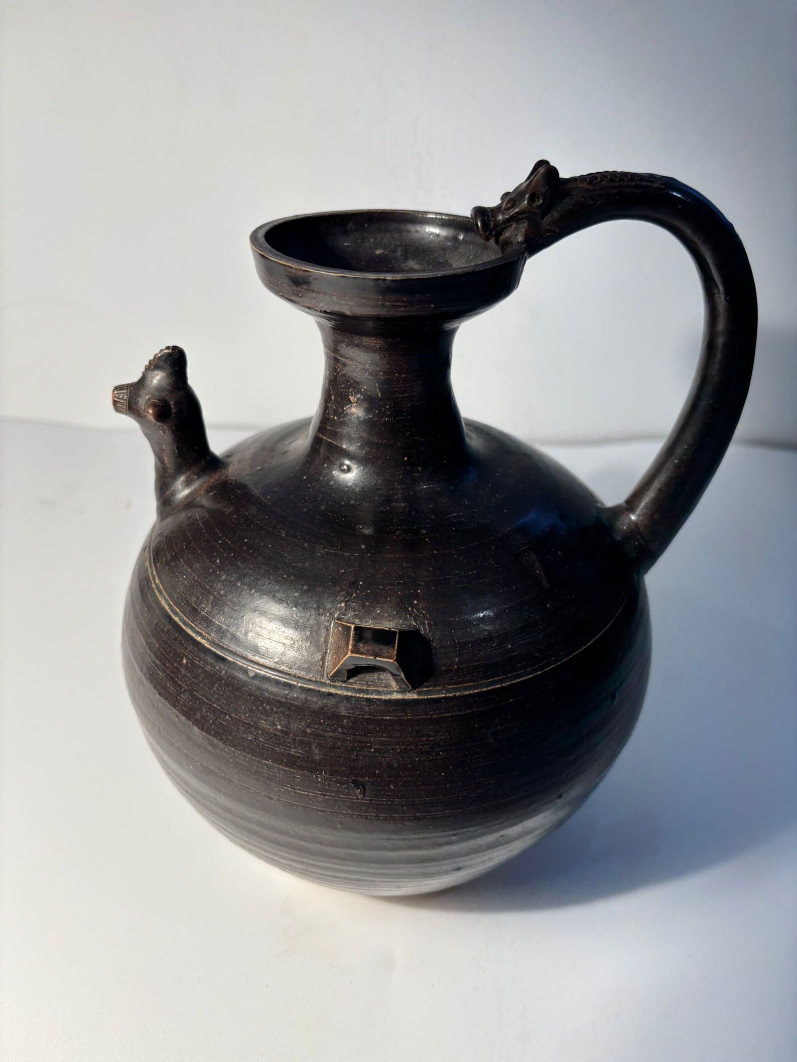 A CHINESE DARK BROWN-GLAZED POTTERY CHICKEN-HEAD EWER (1 of 12)