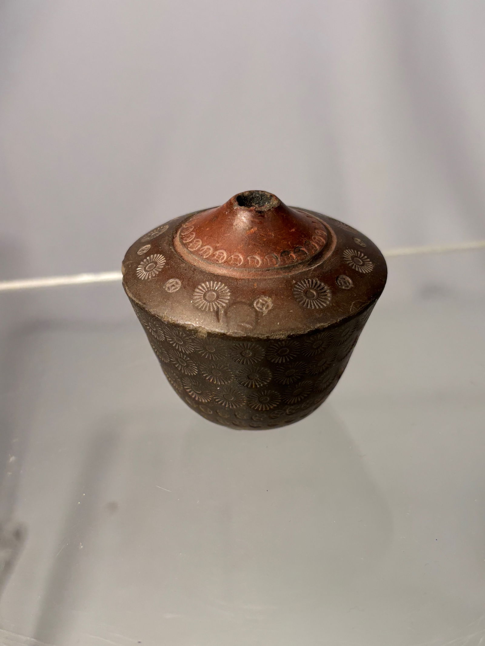 A Chinese Yixing Pottery Opium Pipe Bowl with Impressed Floral Decoration and maker's mark (1 of 10)