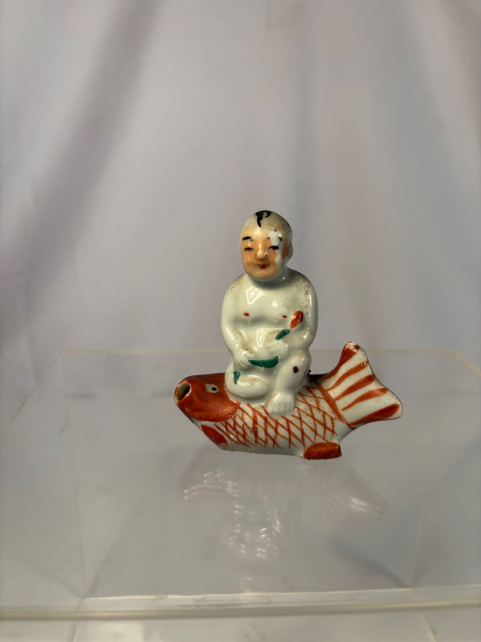 A Chinese Porcelain Figure of a Boy Riding a Carp (1 of 7)