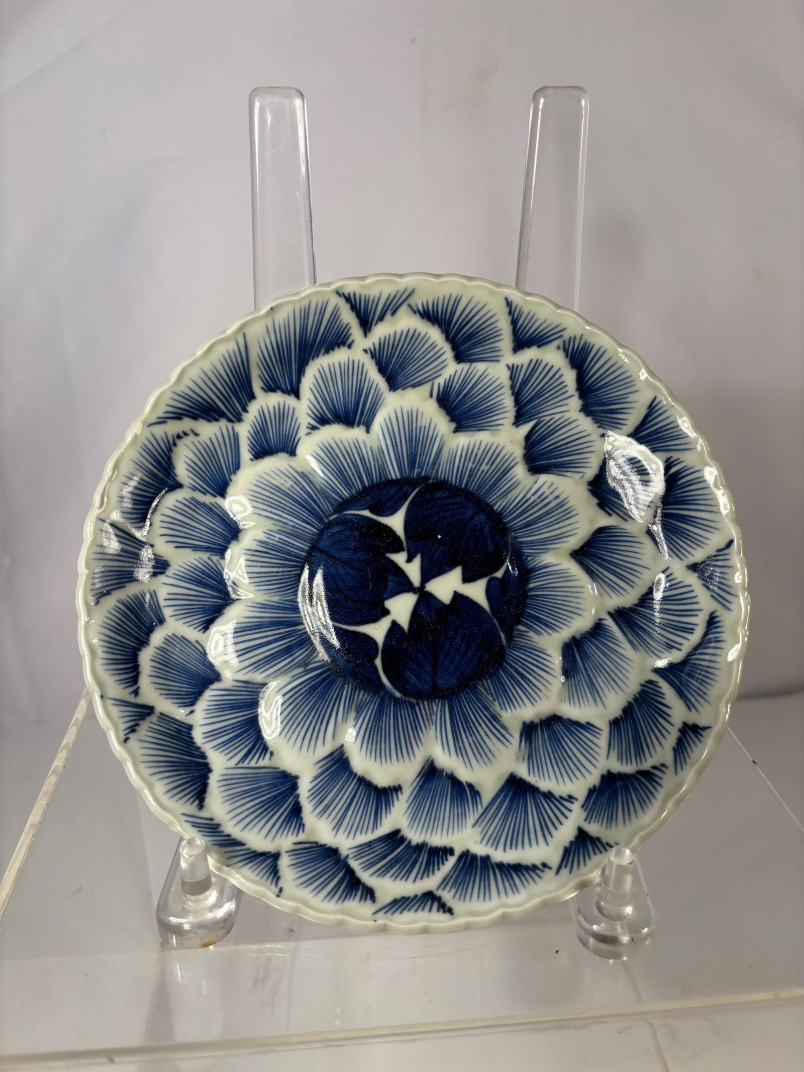 A Japanese Arita Blue-and-White Chrysanthemum-Petal Dish, Late Edo to Early Meiji Period (circa (1 of 10)