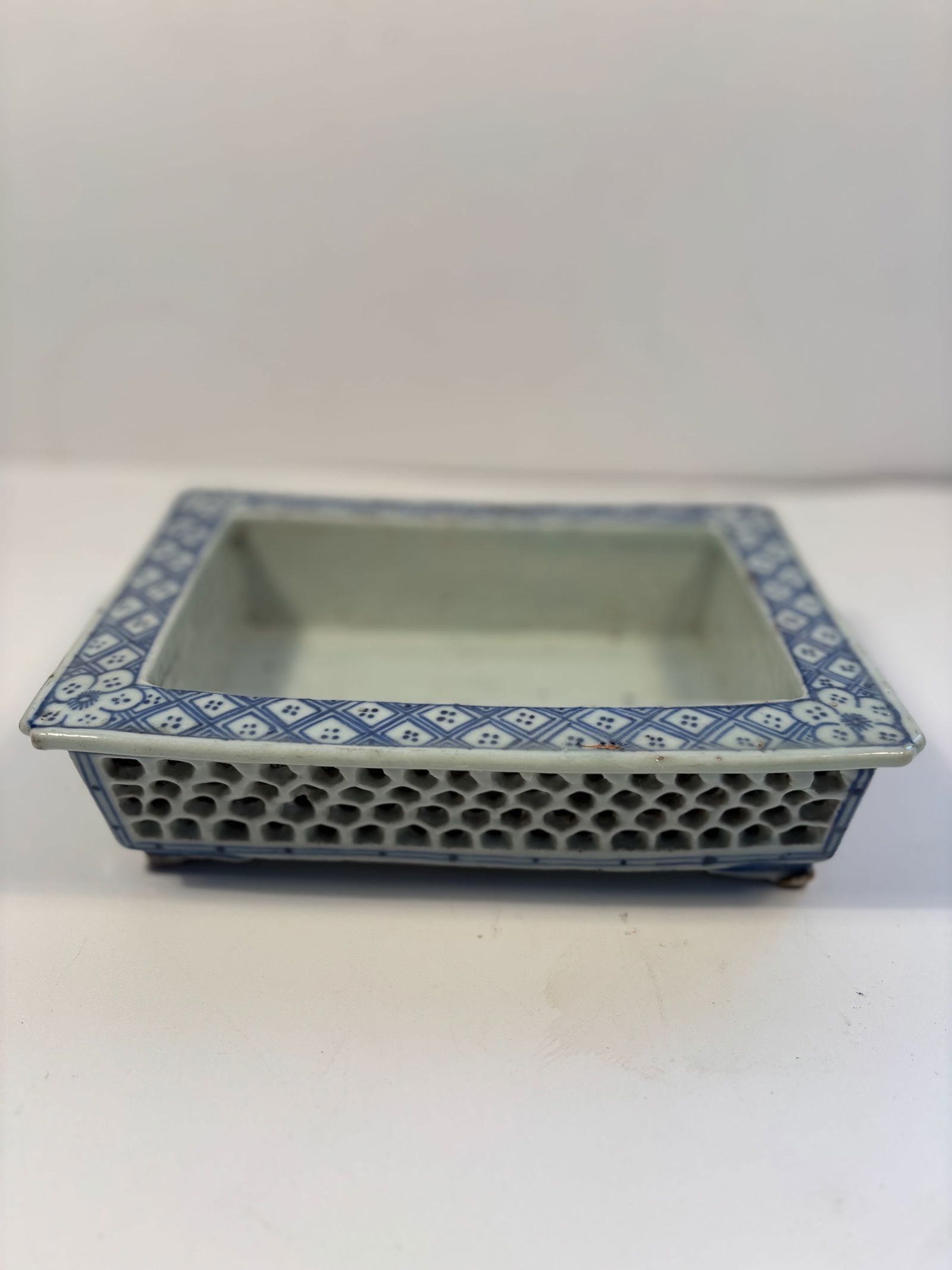 A Chinese rectangular blue and white porcelain brush washer: Qing Dynasty (1644-1912); This is Scholarly itme which has a lattice -patterned decorative design . Dimensions?9" x 6.5" x 2 1/4"