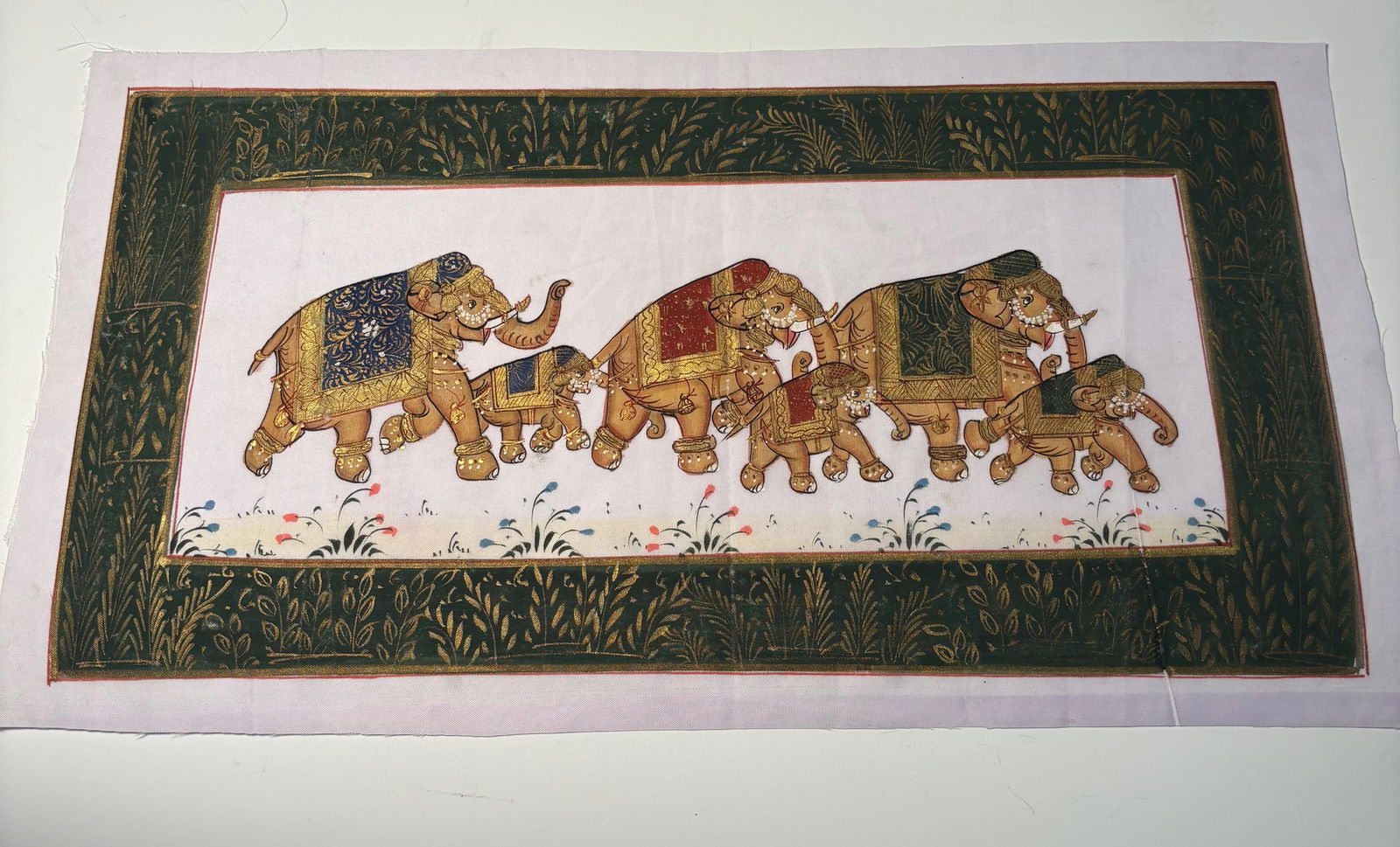 Indian Miniature Gouache on Paper, Procession of Caparisoned Elephants, Jaipur: Early 20th Century ; Indian miniature, gouache and gilt on paper, depicting a procession of four richly adorned elephants, each caparisoned with decorated textiles and ornaments. The composition is ex