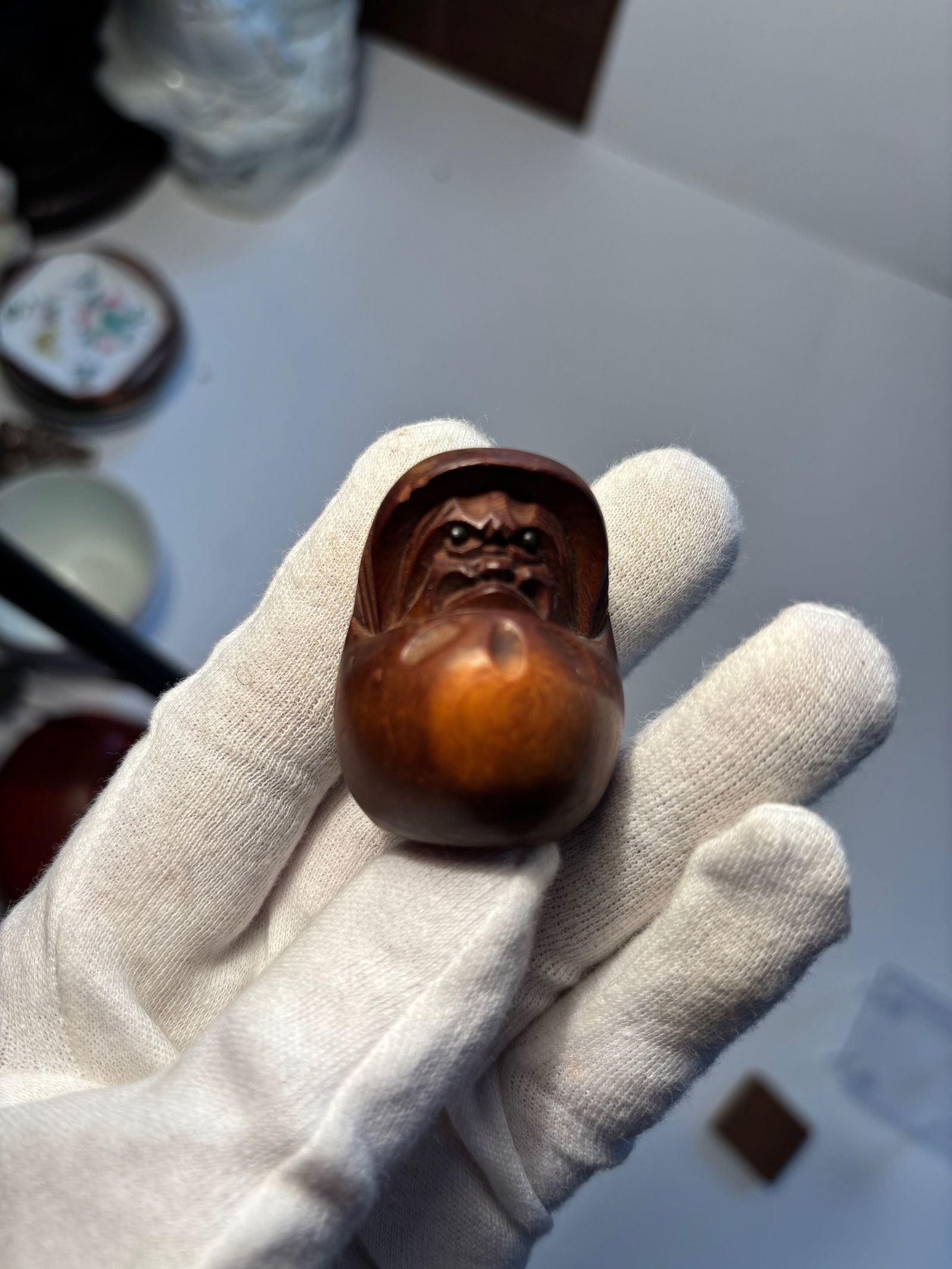 A Japanese boxwood DARUMA With Popping Eyes , wood stand included 6 .5cm 2.6in: 19th century ; The property of a Private Collector. Dimensions?Height with stand 6 cm/2.5in.