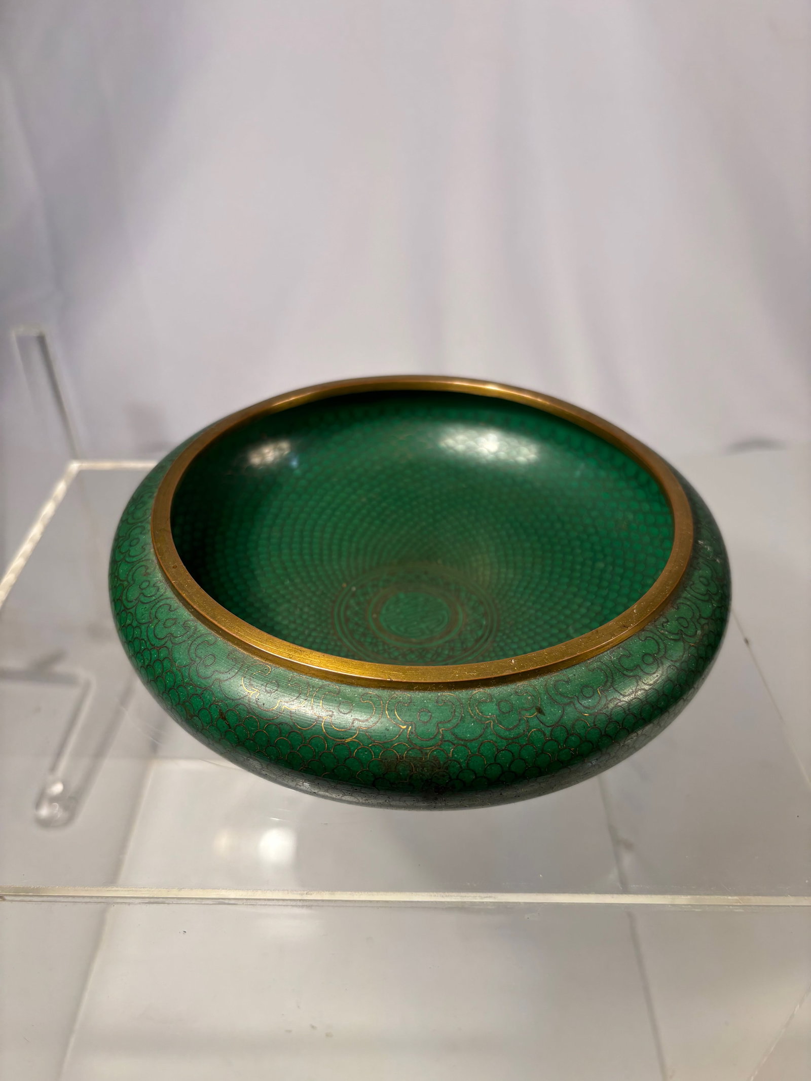 A Chinese Green-Ground Cloisonné Enamel Washer, Qing dynasty(1644-1912): A finely made Chinese cloisonné enamel washer, decorated overall with a dense green “fish-scale” diaper ground formed by extremely fine wirework. The interior features a central medallion wit