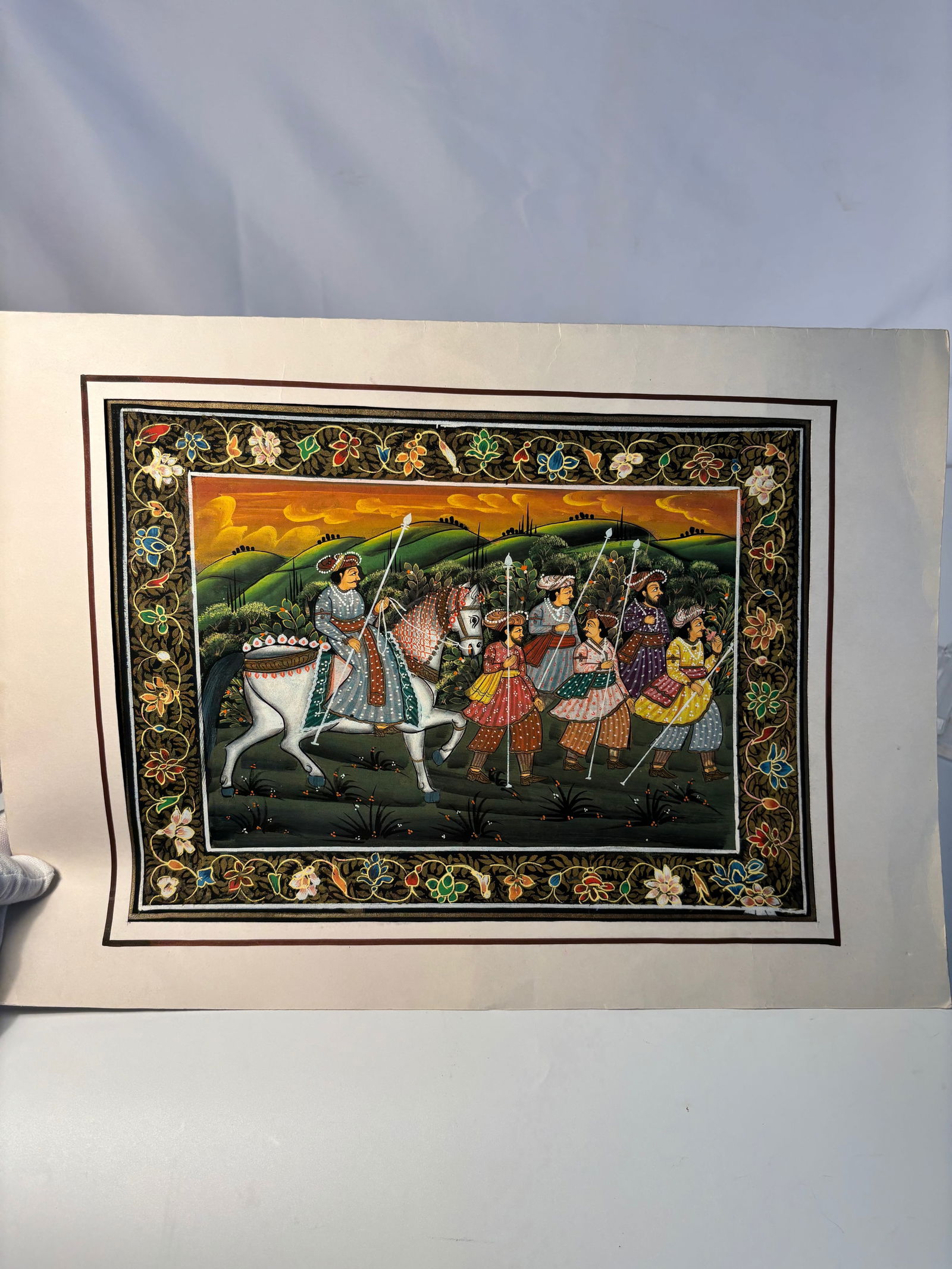 Indian Miniature Gouache on Paper, Nobleman on Horseback with Attendants ed on Paper: 19th century to 20th century; A finely detailed Indian miniature executed in gouache on paper, depicting a nobleman or prince on horseback accompanied by six attendants carrying spears. The figures ar