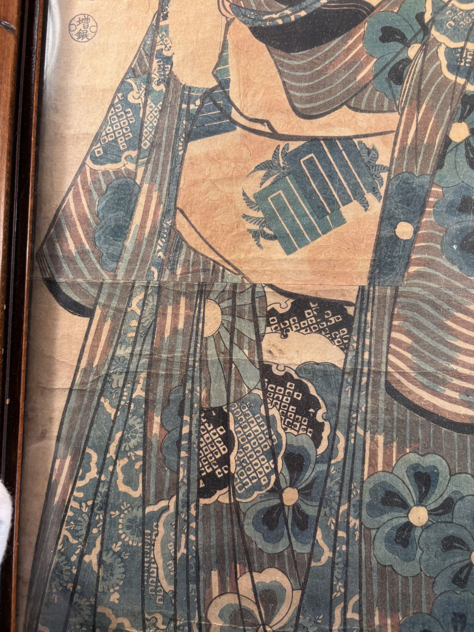 Utagawa Kuniyoshi Woodblock Print – Edo Period Bijin Portrait, Signed: Mid-19th century, likely 1840s–1850s; The figure is a bijin (beautiful woman), holding an item (possibly a poem slip or towel), dressed in intricate kimono. This is likely part of Kuniyoshi’s biji