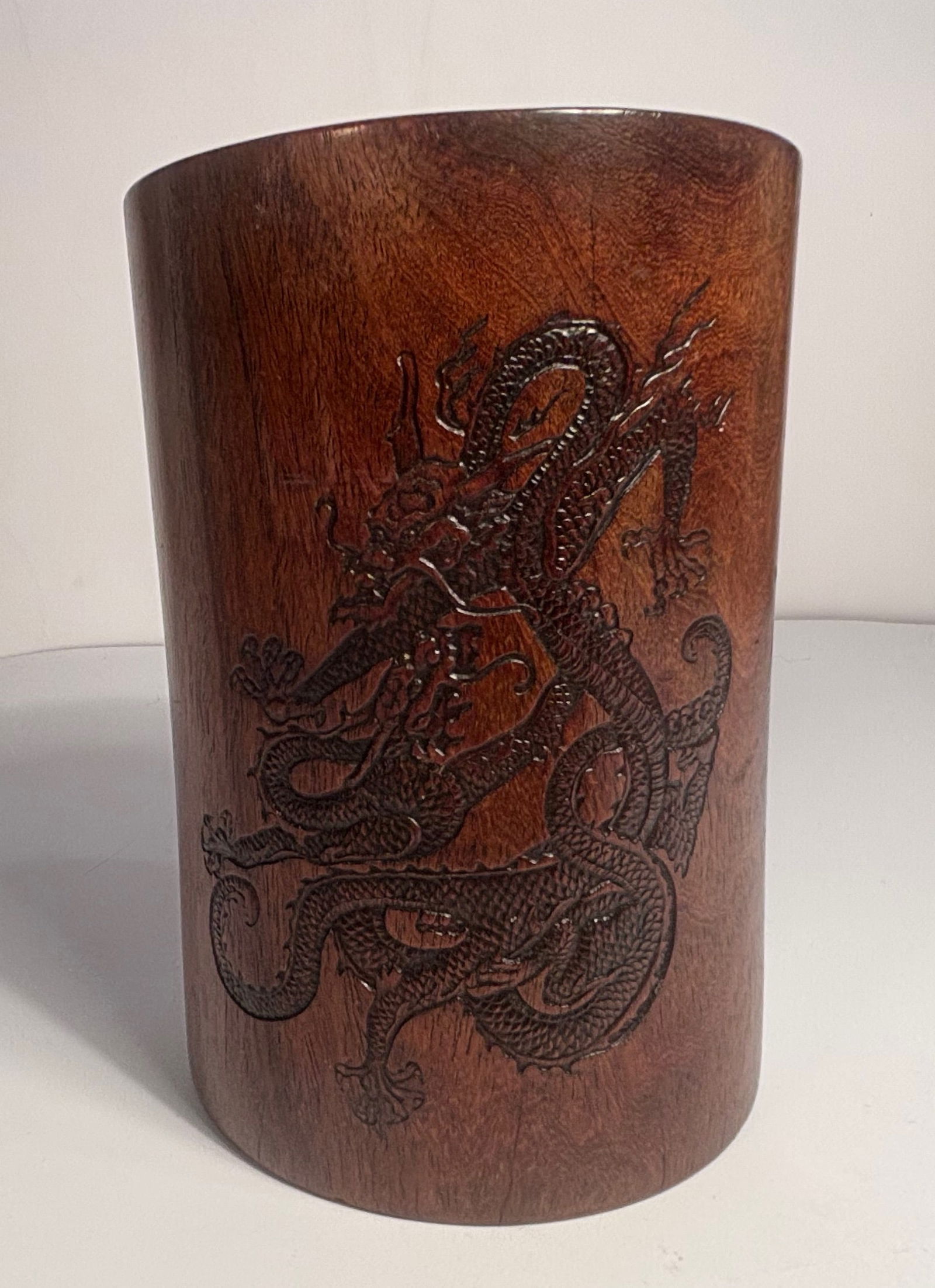 A Chinese HUANGHUALI BRUSH POT CARVED WITH DRAGON AND CALIGRAPHY: Qing Dynasty (1644-1912);The is an elaborately crafted brush pot , featuring carved WITH DRAGON , CALLIGRAPHY and Mark. Provenance: From an prominent Midwest family collection in USDimensions?Height: