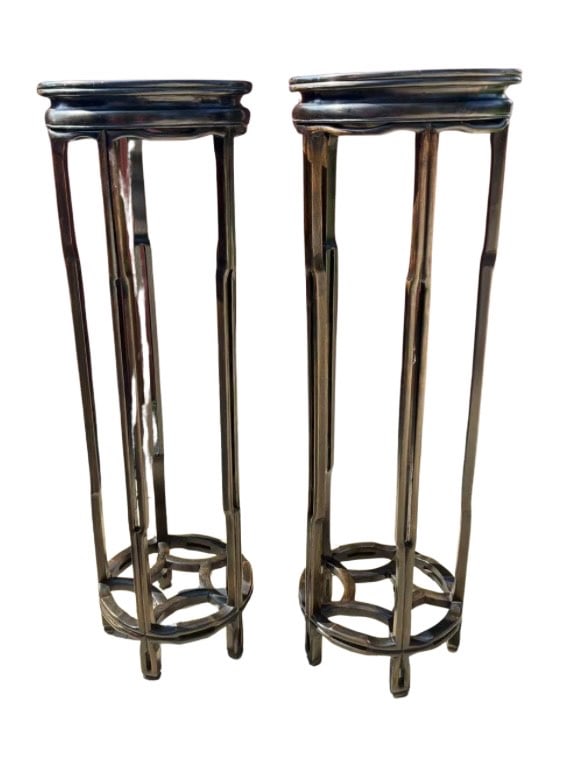 Pair of very high hand carved wood pedestal stands: A finely crafted pair of tall Chinese hand carved wood pedestal stands, , each featuring a circular top over four elegantly tapering legs joined by an openwork geometric stretcher with intersecting ri