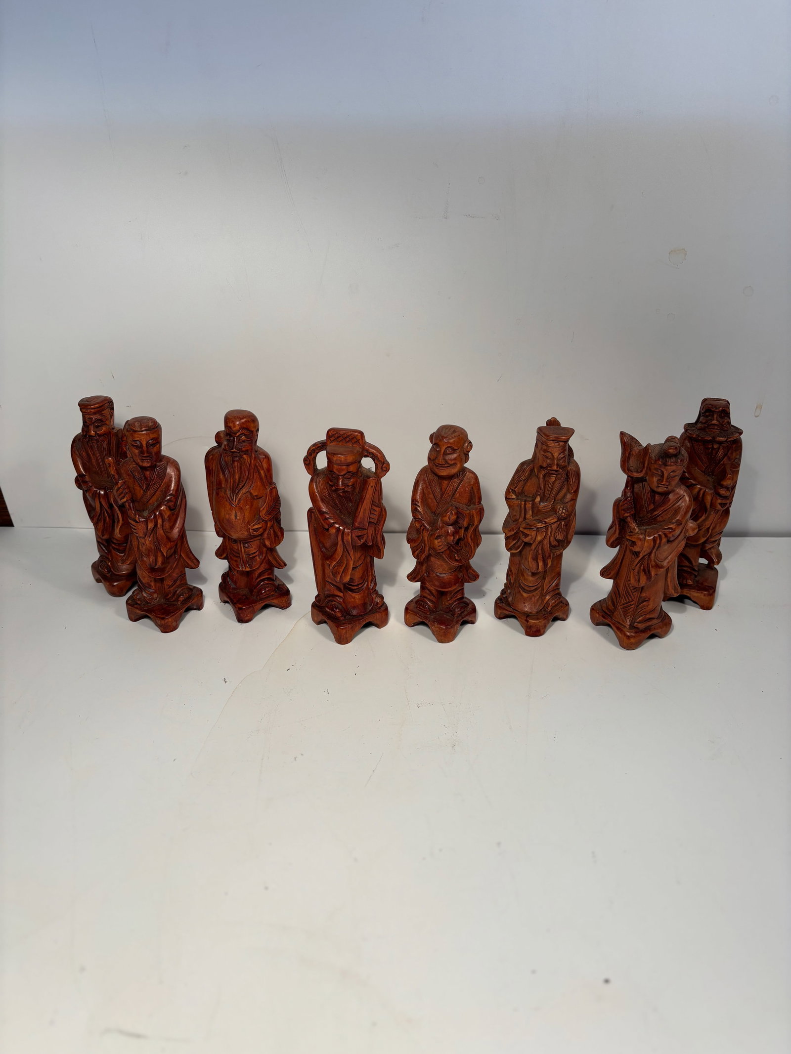 set of 8 Chinese boxwood carved immortals: 19th -20th century;These 8 small carved figures appear to be Chinese immortals, scholars, or Daoist figures; Dimensions?Height: 6 inches.