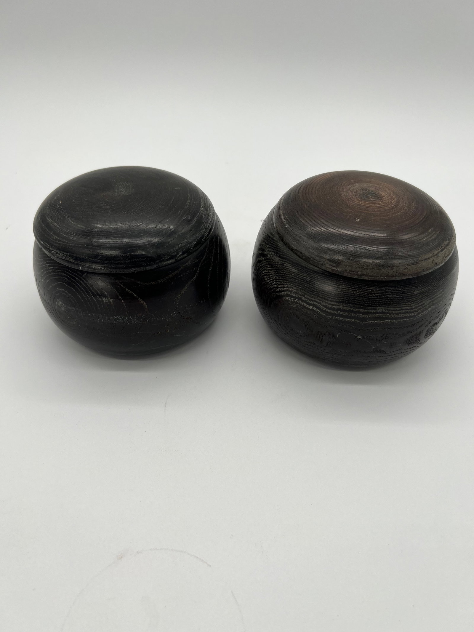 A pair of Japanese wood Wenqi containers: The pair of vintage Weiqi round containers are used to store the game’s stones, (one for black stones and one for white stones), which are all included in the container together. Dimensions?Height: