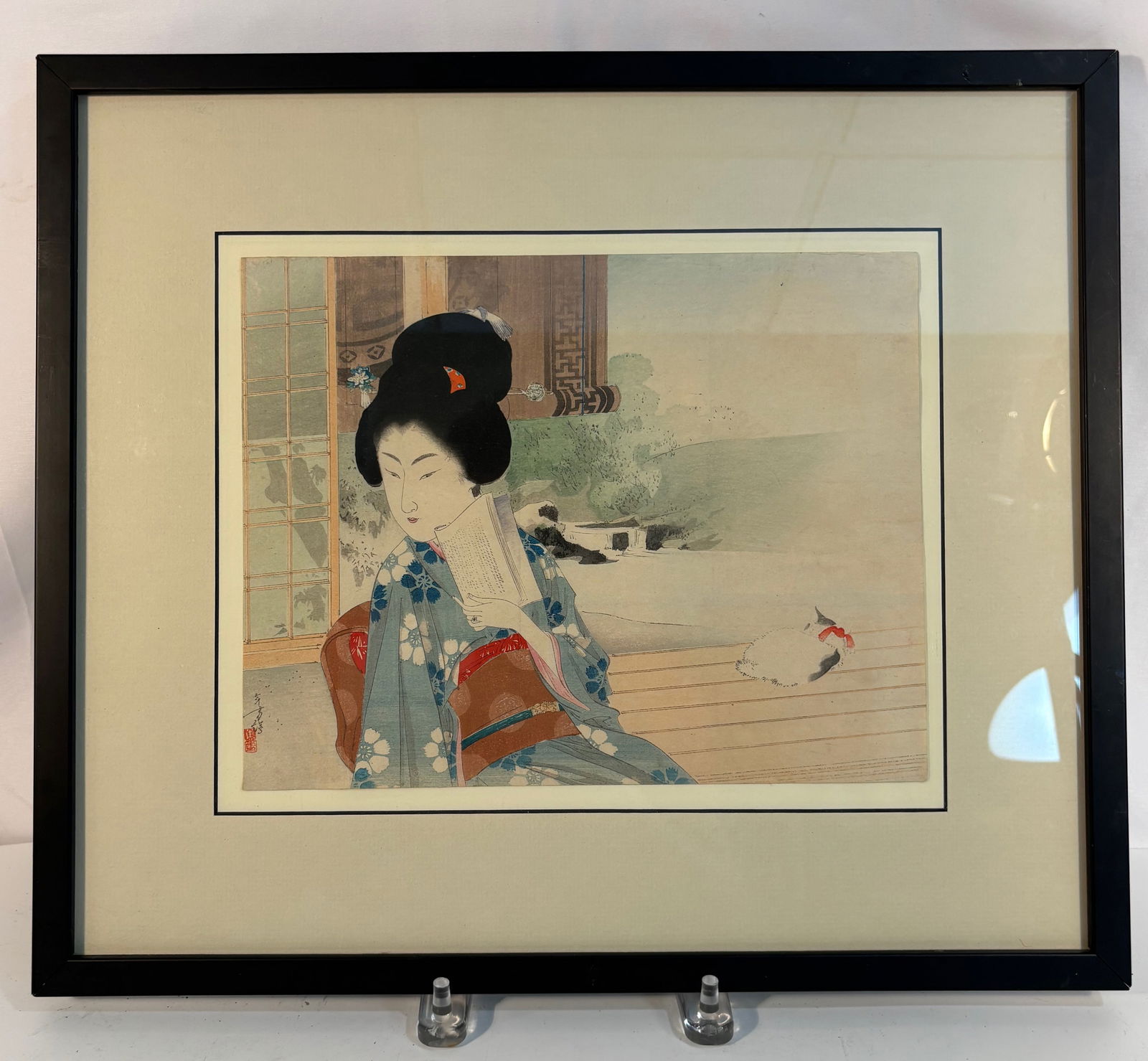 Mizuno Toshikata (1866–1908), A Seated Beauty with a Cat, Watercolor and Gouache on Paper, ca.: Depicting a young woman dressed in a blue kimono patterned with white blossoms, seated on a veranda while holding a fan. Behind her stands a sliding sh?ji screen, with a white cat resting leisurely ne