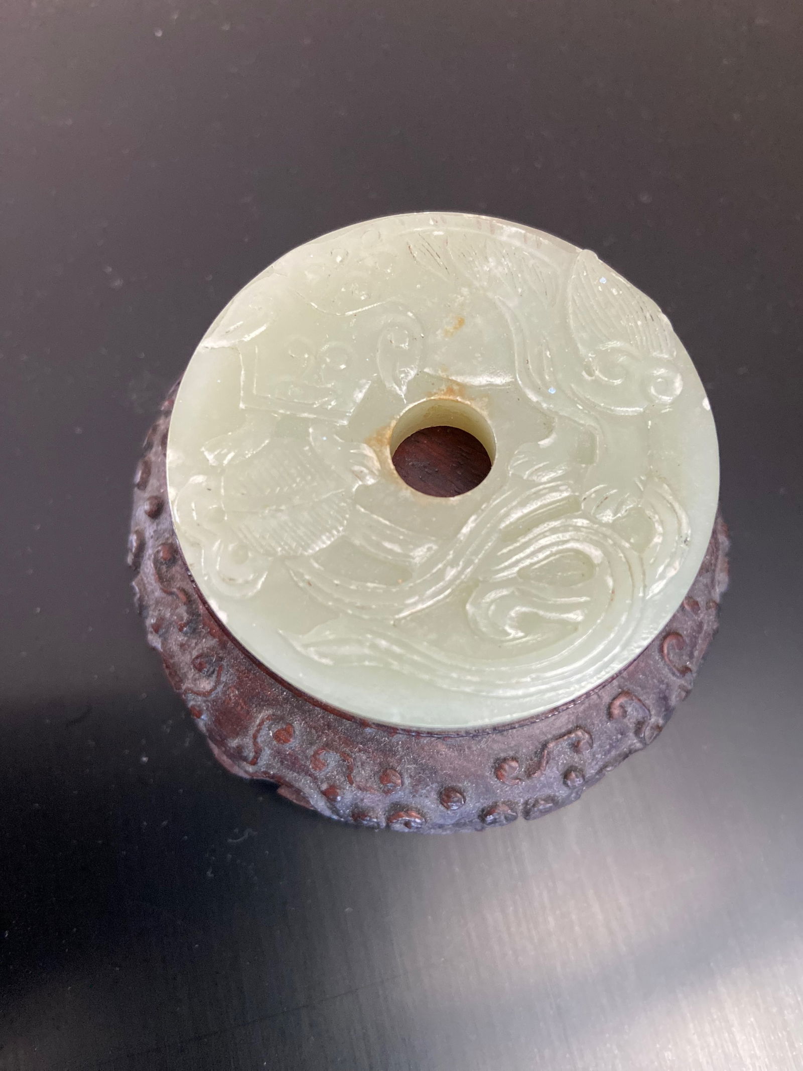 A Chinese nephrite jade round plaque (1 of 8)