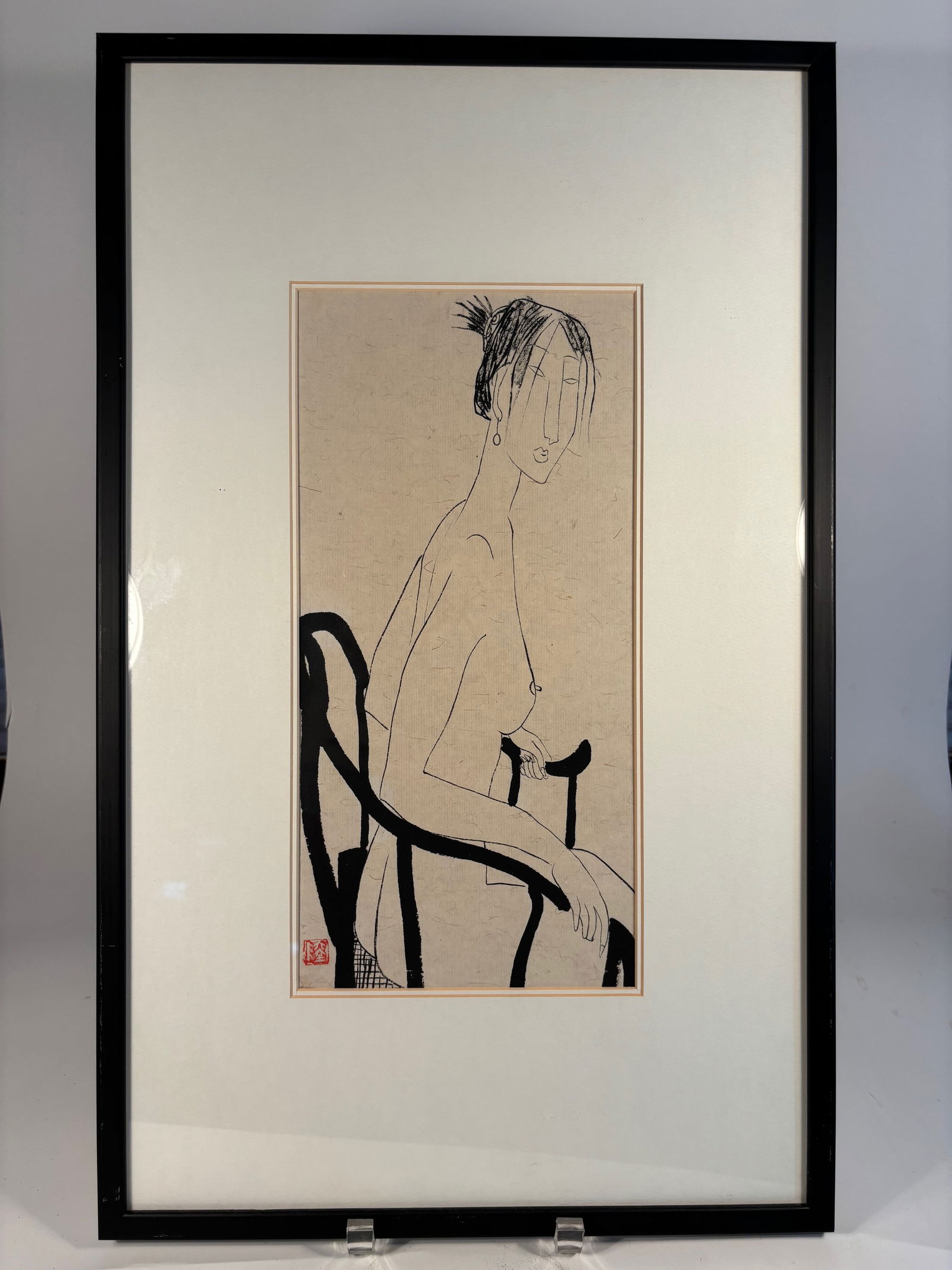 A Chinese Ink Painting of a Seated Nude Woman with Seal Mark "LU": Ink painting on paper depicting a stylized nude woman seated in a Ming-style armchair. Executed in elegant linear brushwork with minimal detail, the composition emphasizes form and posture. A red arti