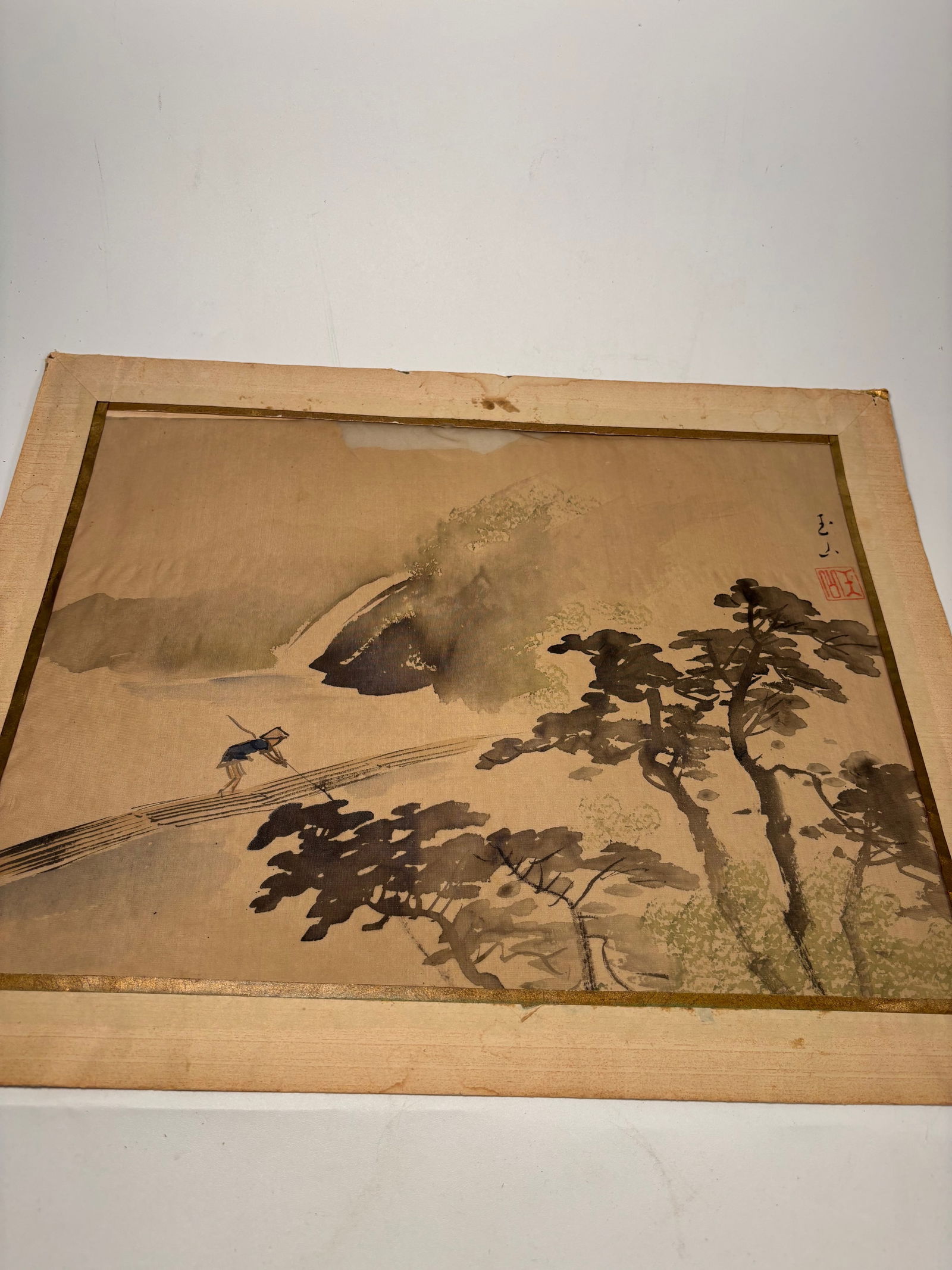 A Japanese water color paint on silk Signed Gyokuzan (??): 19th century; A Japanese watercolor paintings on silk, each depicting a tranquil landscape in the Nihonga tradition. One features a lone traveler crossing a narrow bridge into the mist, the other a bo