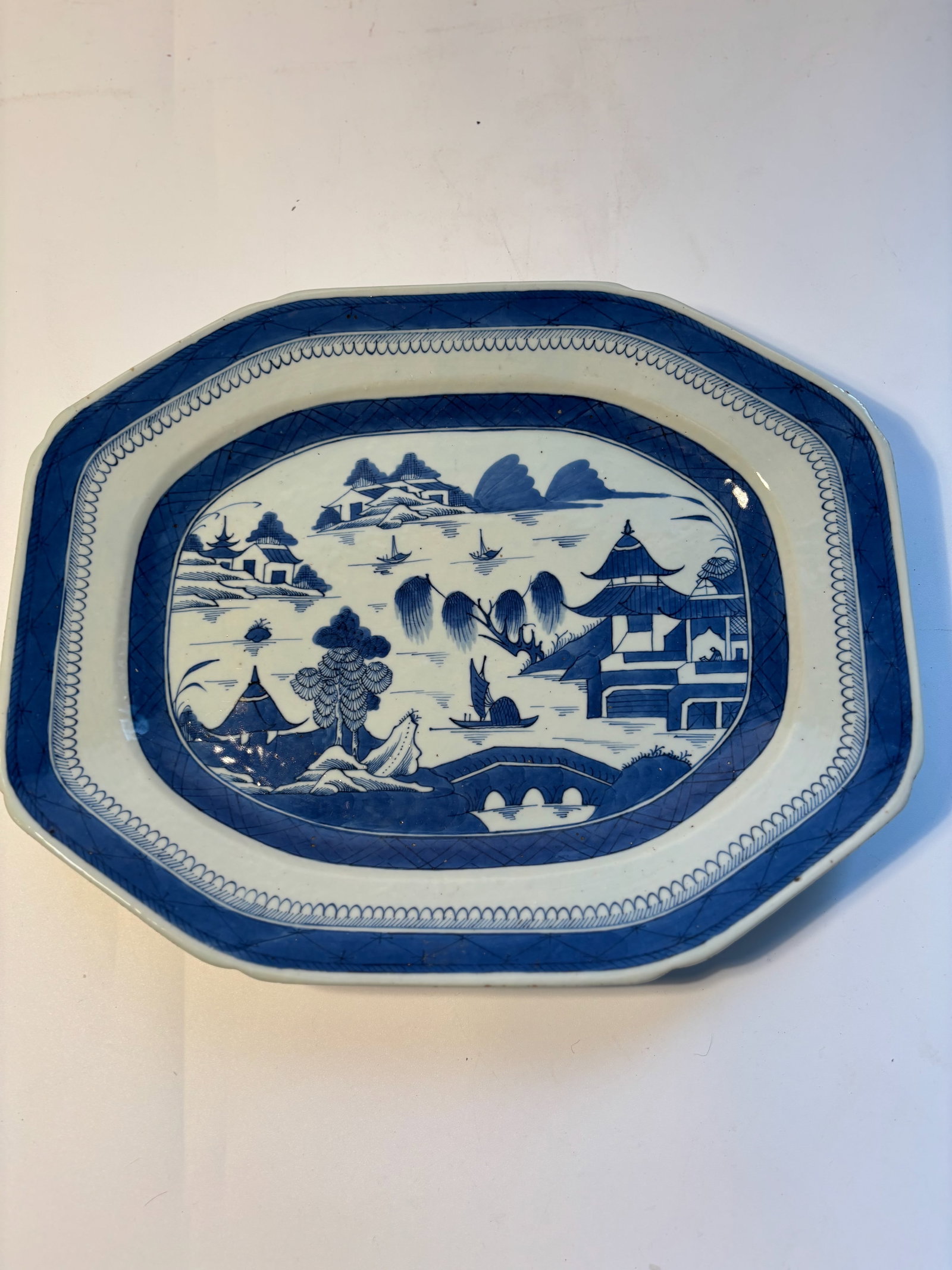 A large Chinese blue and white porcelain charger: Qing dynasty (1644–1912); Dimensions? 14.5" x 11.5"x 1 3/4"