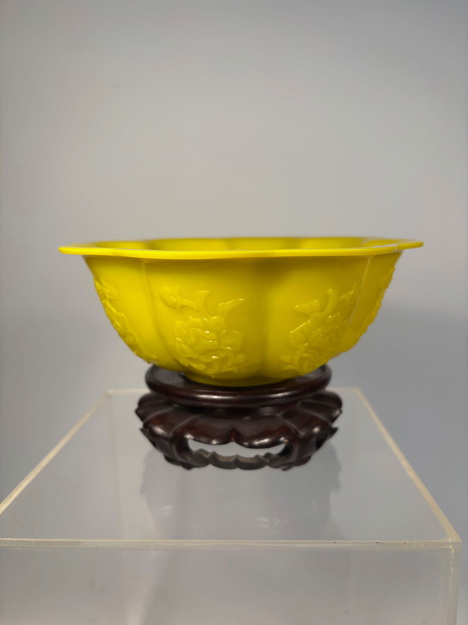 A Chinese Peking Glass Lobed Bowl – Imperial Yellow Molded Floral Design: Qing Dynasty(1644-1912); A beautifully molded Chinese Peking glass bowl in the form of a lobed melon, rendered in a brilliant imperial yellow hue. The body features finely detailed relief-molded flora