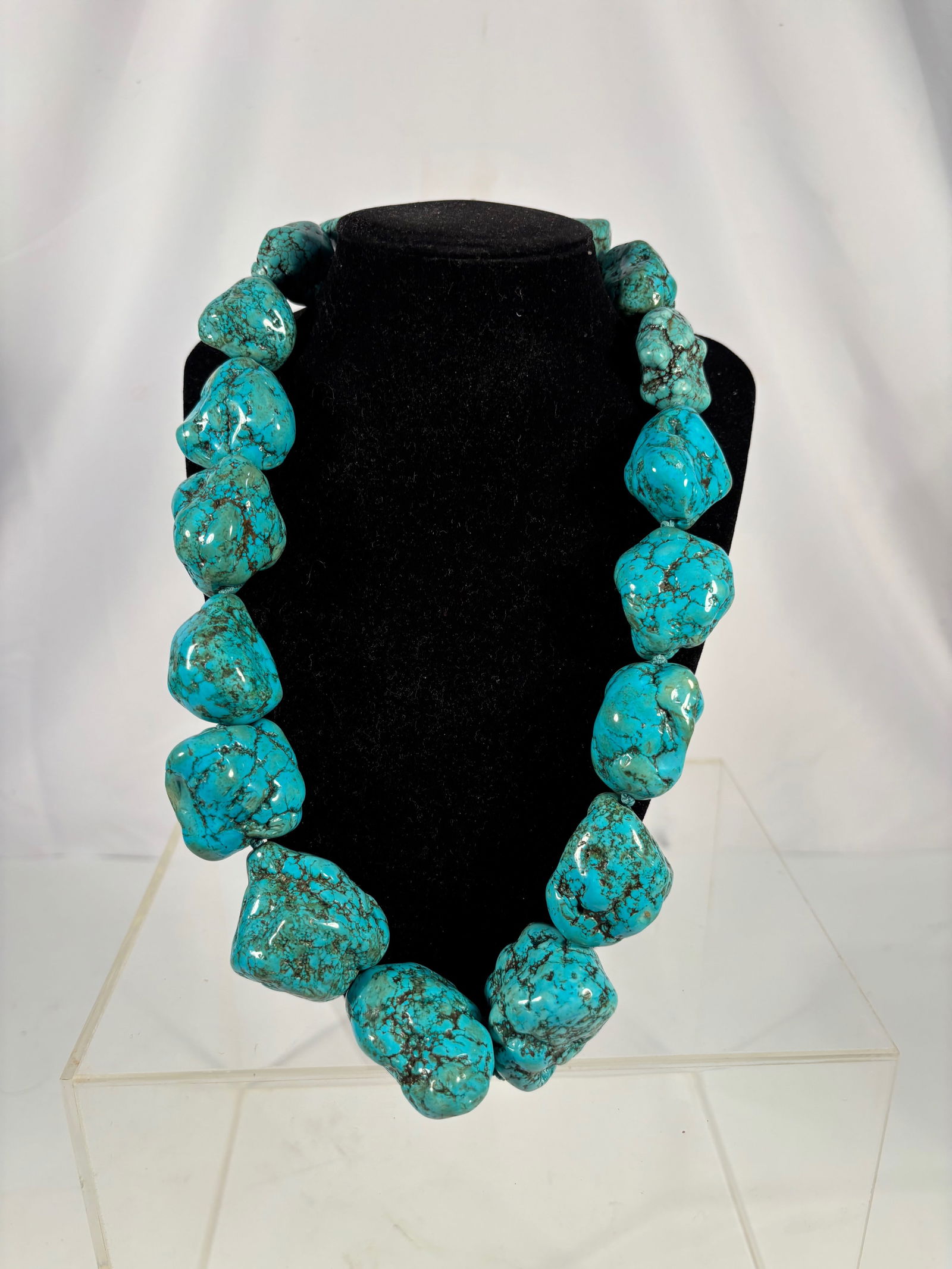 A Large Heavy Natural Turquoise Nugget Necklace, 18 oz/ 510g: A striking hand-strung necklace composed of large natural turquoise nugget beads, each displaying vibrant blue coloration with dark brown to black matrix veining. The beads are irregular in form, enha
