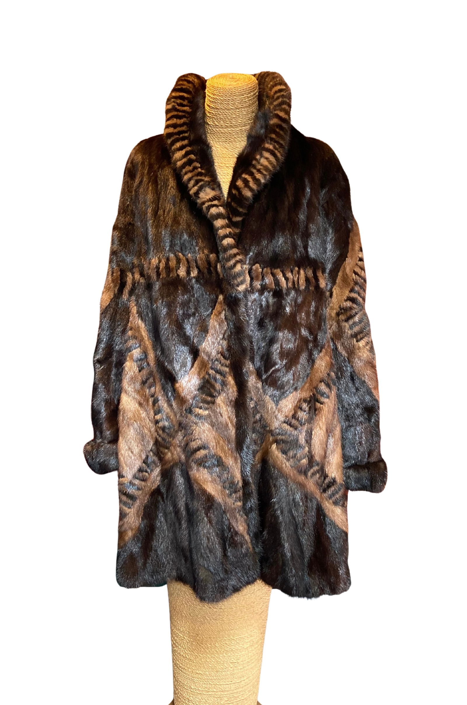 Marshall Field’s Patterned Mink Fur Coat with Sculpted Geometric Design: Luxurious vintage mink fur coat featuring a striking sculpted geometric pattern created through precision shearing and carving techniques. The design combines rich dark brown and warm caramel tones, w