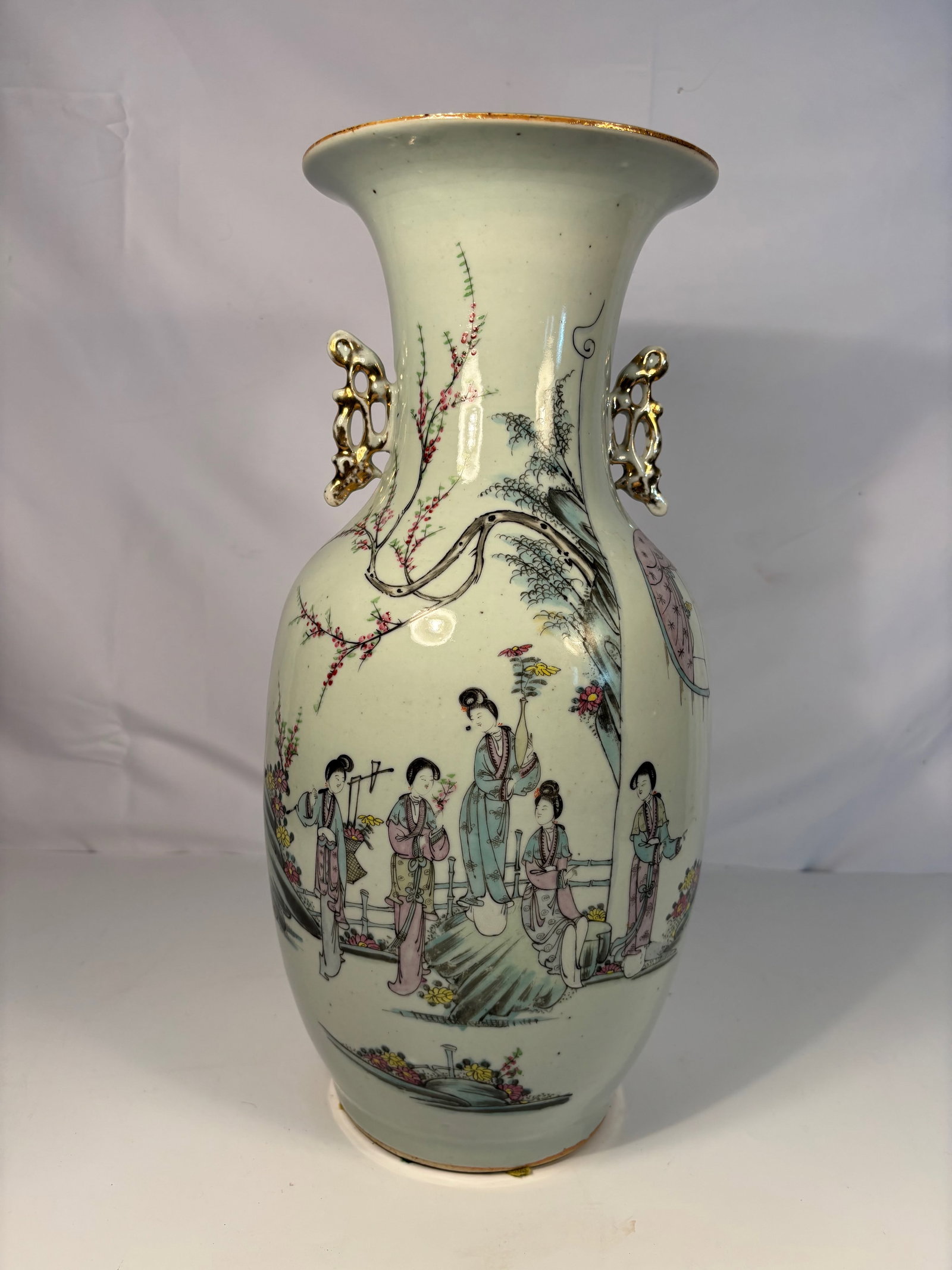 A Chinese Famille Rose Vase with Figures and Poetic Inscription: 19th century to early 20th century, A Chinese porcelain baluster vase finely enameled in famille rose enamels, depicting a group of court ladies in a garden landscape beneath blossoming branches. The