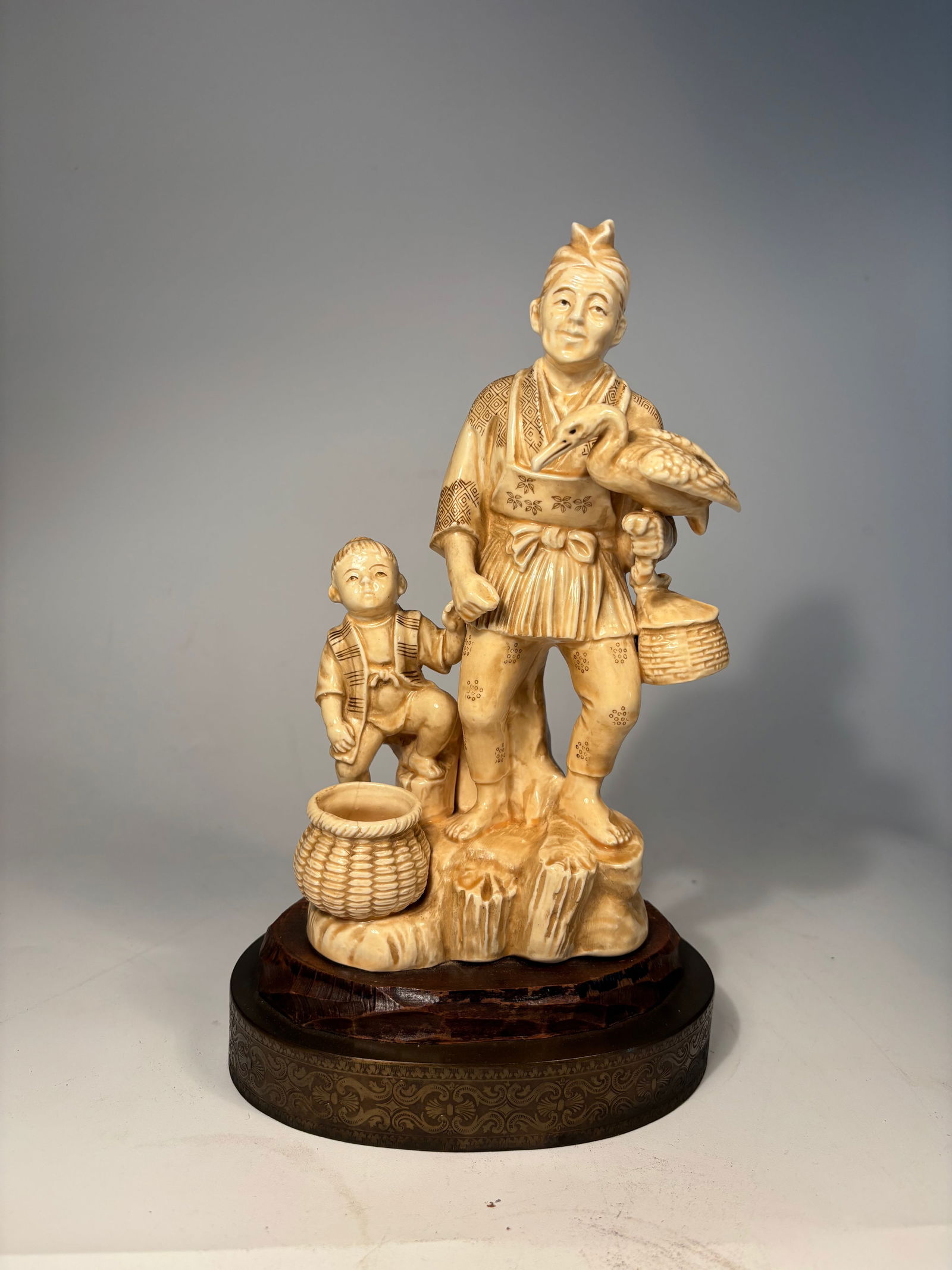 A Japanese Moriyama porcelain statue of fisherman and child (1 of 12)