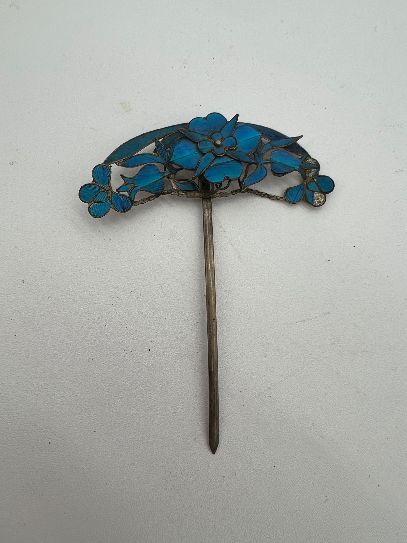 A kingfisher feather hairpin: Qing Dynasty (1644–1912) , the pin is adorned with kingfisher feather inlay.Dimensions? Length: 3.5 inches , width: 2.5 inches