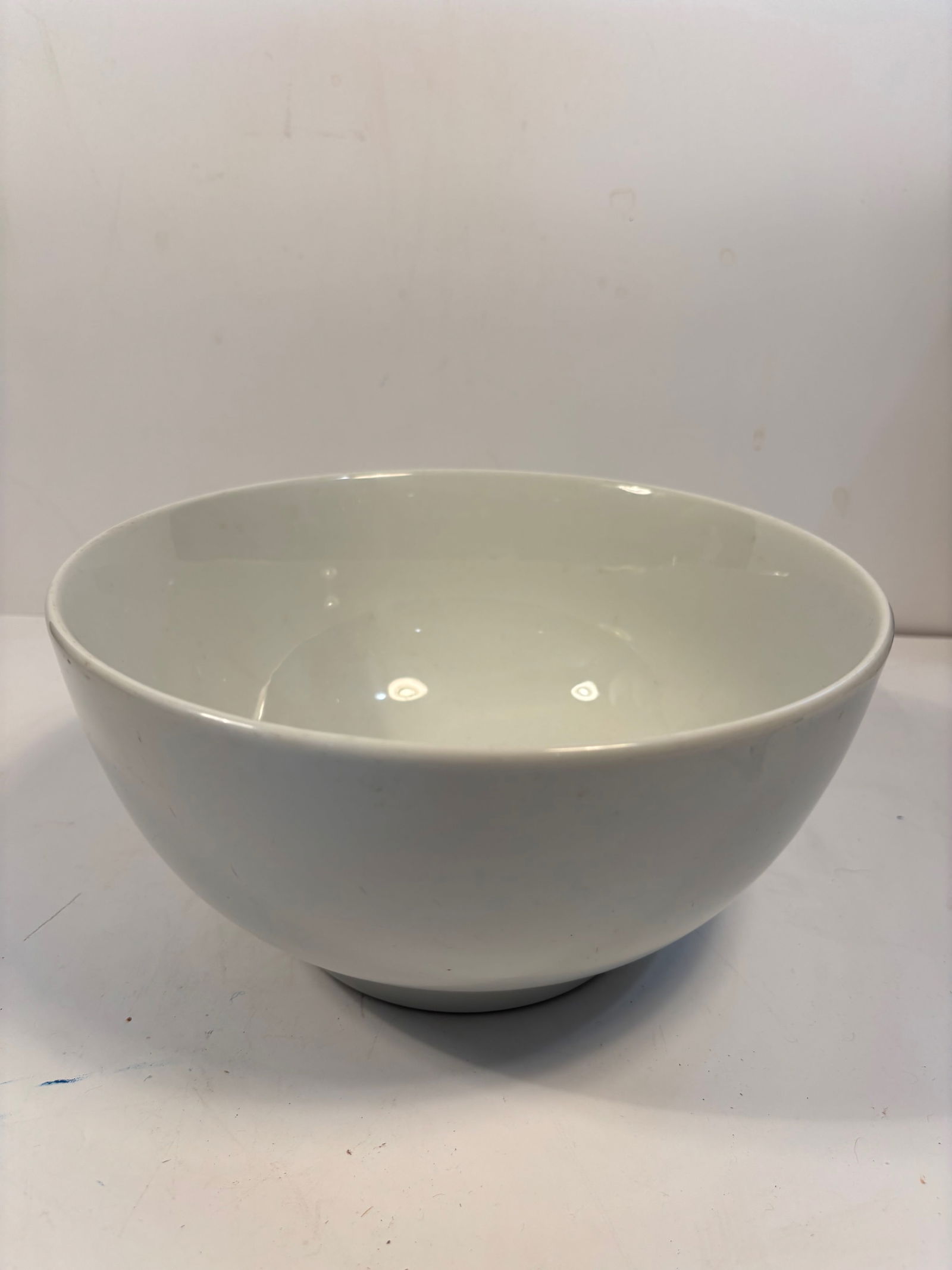 A Chinese Blanc de Chine porcelain bowl: Late 19th century to early 20th century. The foot rim has firing residue and age-toning. Dimensions?Height: 9.75 inches; Diameter: 5 inches.