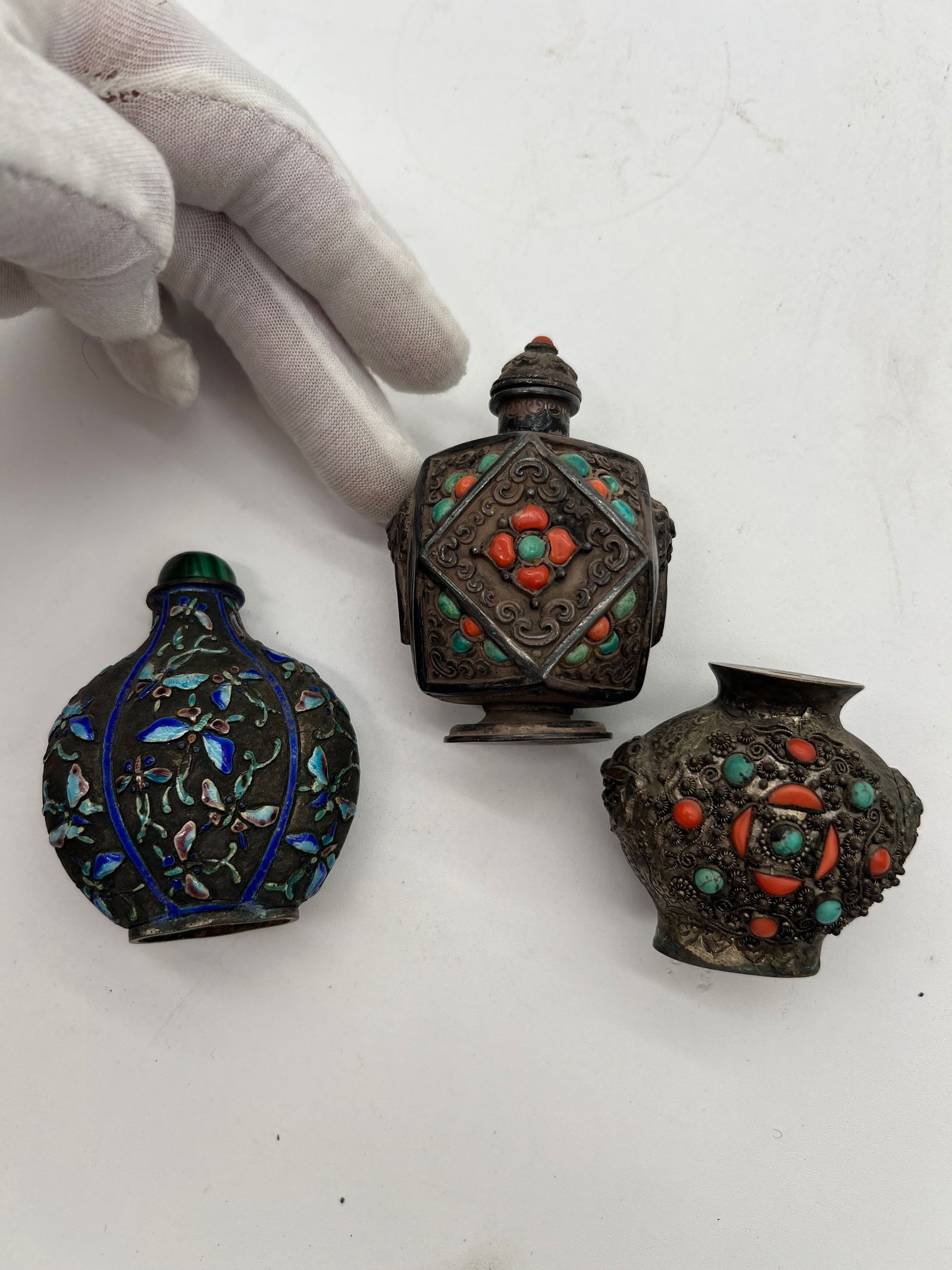 Three Chinese silver enamel snuff bottles with coral and turquoise inlays: Qing Dynasty (1644–1912) ,Dimensions? highest Height: 3 inches