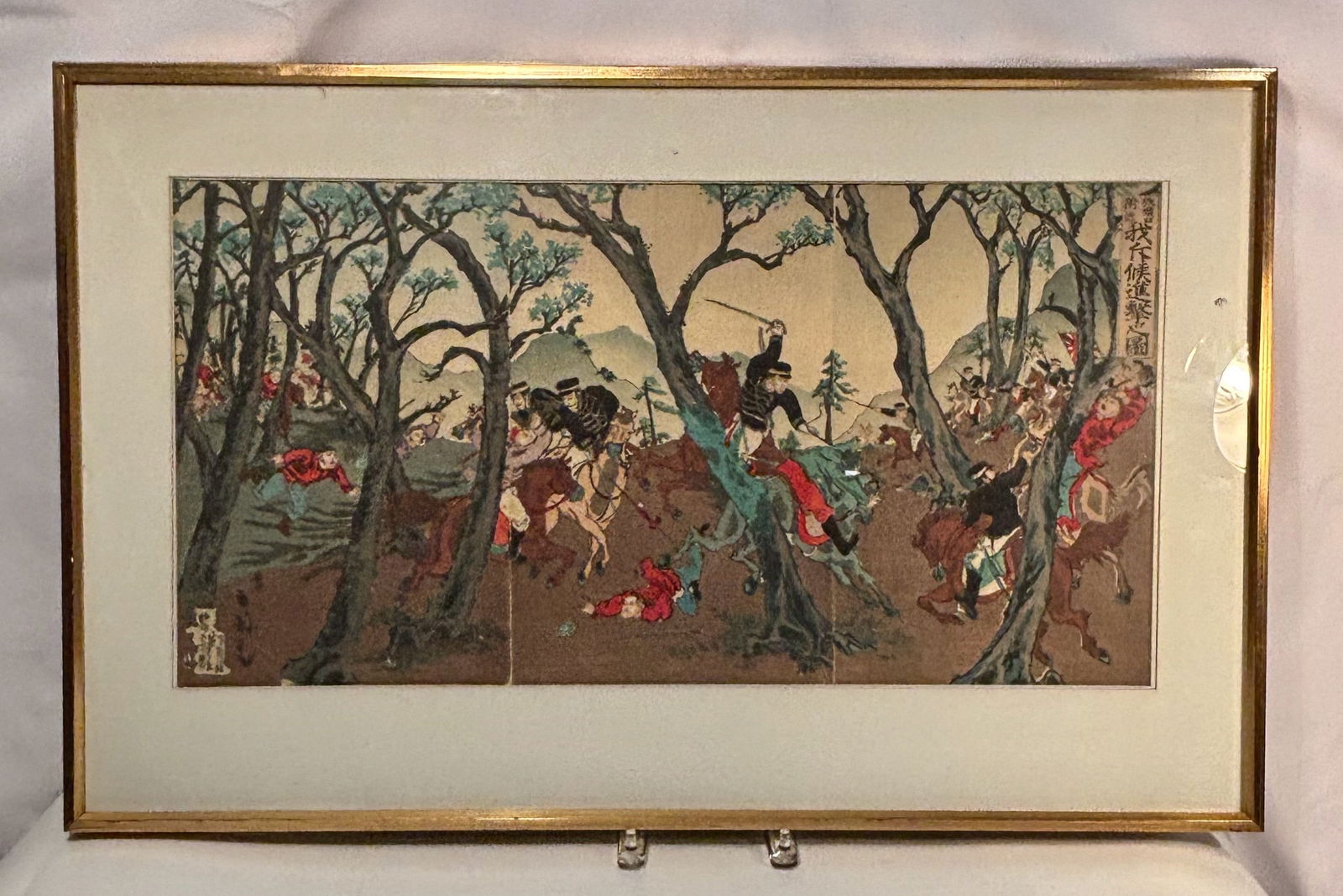 Large Japanese Woodblock Battle Scene by Kokunimasat – Triptych Panel: A Meiji-period Japanese woodblock print by Utagawa Kokunimasa (????, pupil of Ogata Gekk?), depicting a dramatic cavalry charge during the First Sino-Japanese War (1894–1895).The title cartouche rea