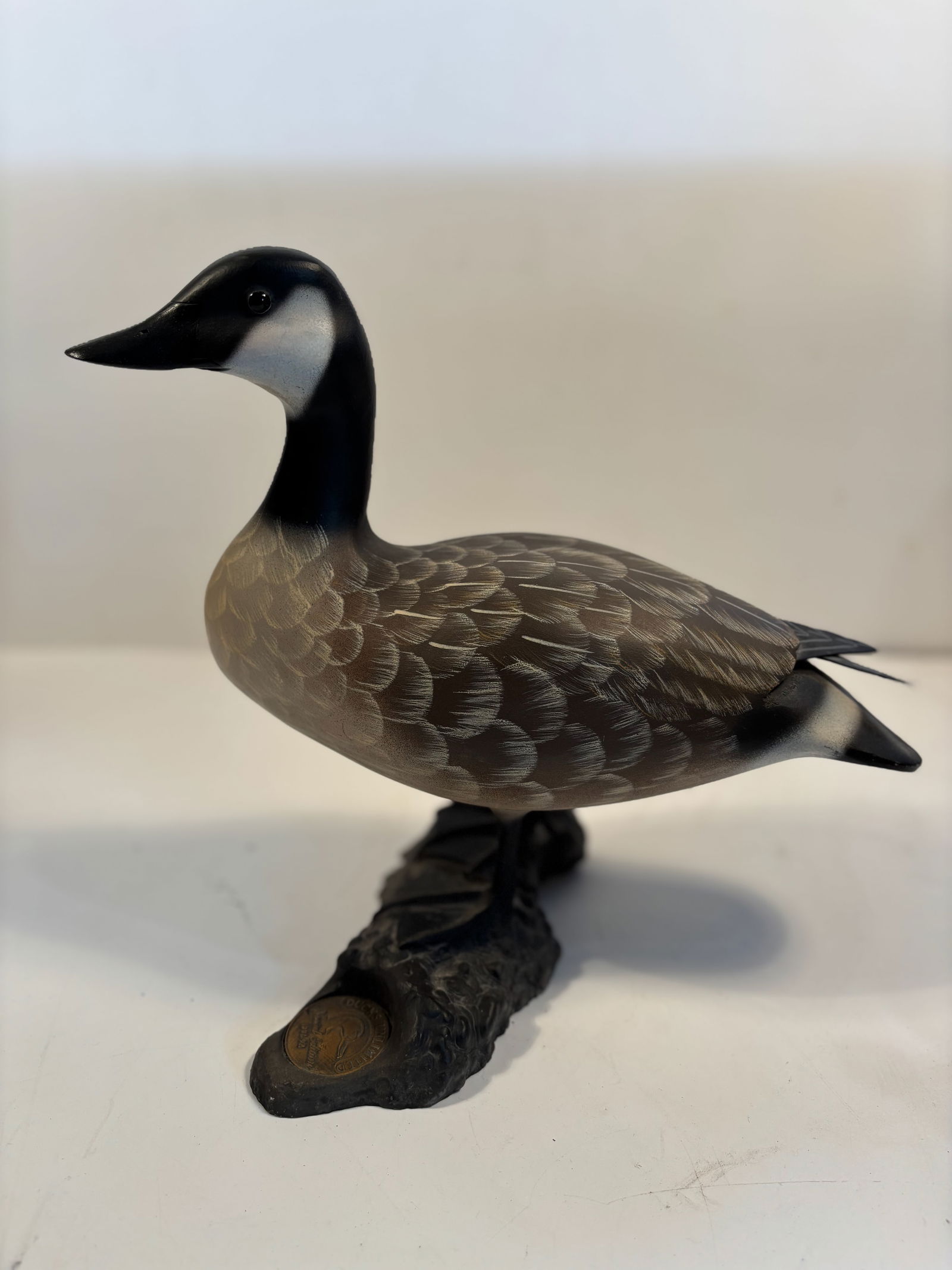 Ducks Unlimited duck decoy Canada Goose Special Ed 1991-92 signed William Veasey: A metal medallion embedded in the base reads: "Ducks Unlimited Special Edition 1991–92”; Dimensions?11 inches high x 13 inches length ;