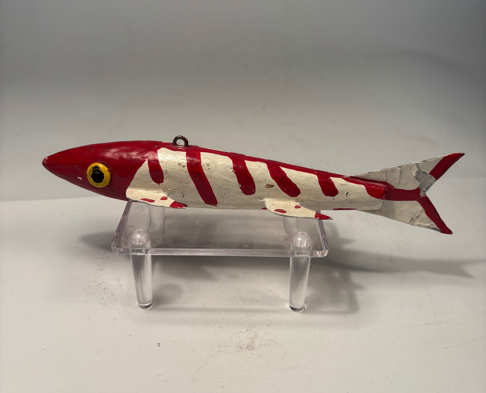 Weighted Hand-Carved Fish Spearing Decoy, Ice Fishing, Folk Art: Hand-carved and painted wooden ice fishing spearing decoy, featuring a red head, white body with red spots, and multiple attached fins. The decoy is weighted for proper underwater action and fitted