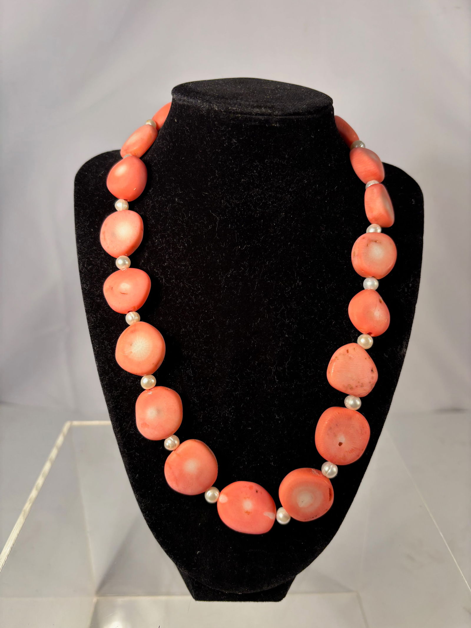 A Natural Salmon Coral Nugget Bead Necklace: Vintage coral bead necklace featuring a strand of natural salmon-pink coral nuggets, each bead organically shaped with natural surface pits and color variations typical of real coral. The beads are sp