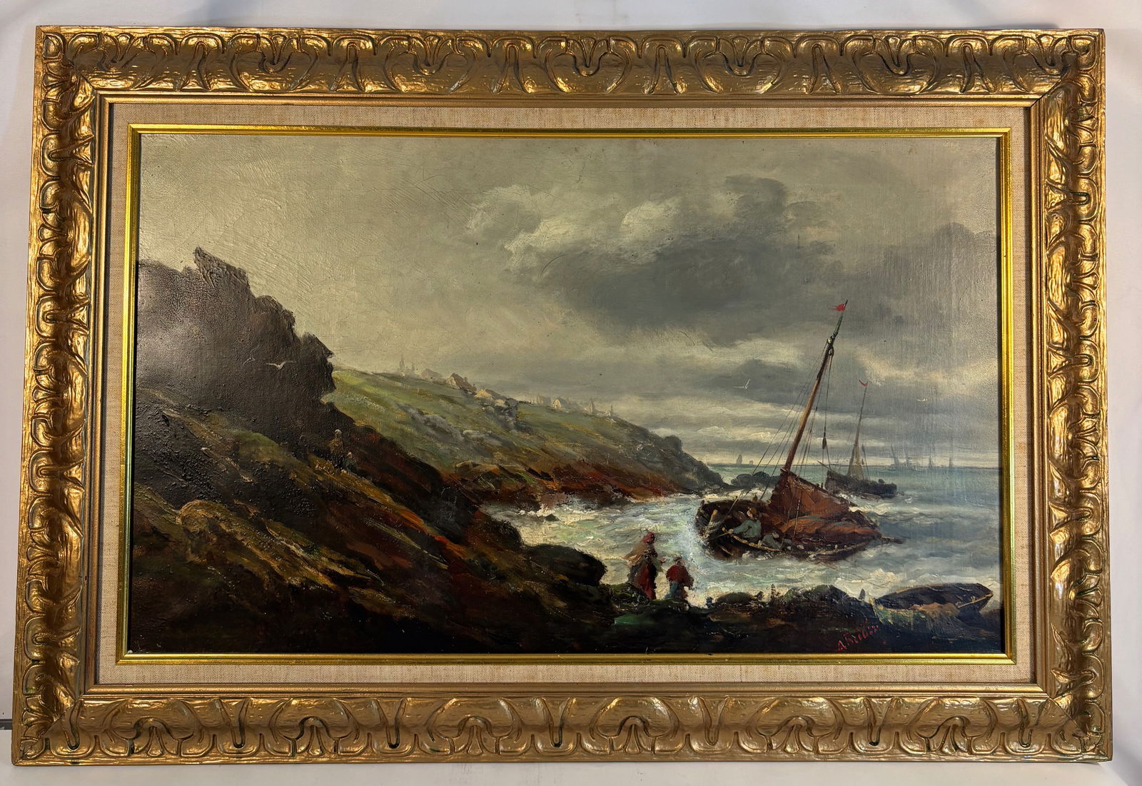 “After the Storm?? — Coastal Shipwreck with Fishermen, Signed A. Budin: A dramatic 19th-century marine painting depicting a stormy coastal landscape with a wrecked sailing vessel driven against the rocky shore. Two figures stand near the surf observing the scene as waves