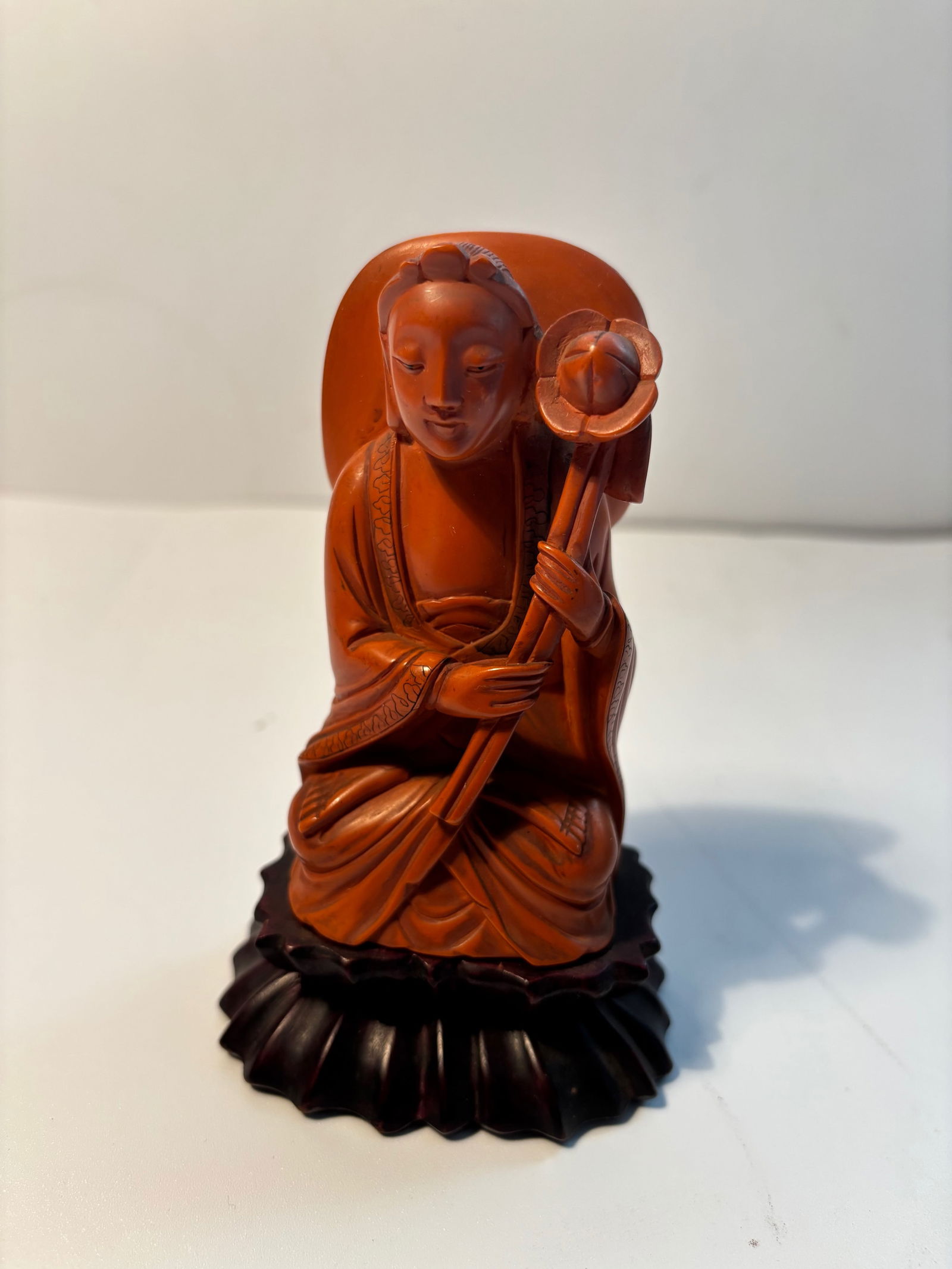 A Chinese boxwood carved seated Guanyin statue: 19th century; Dimensions?height: 5 1/4 inches