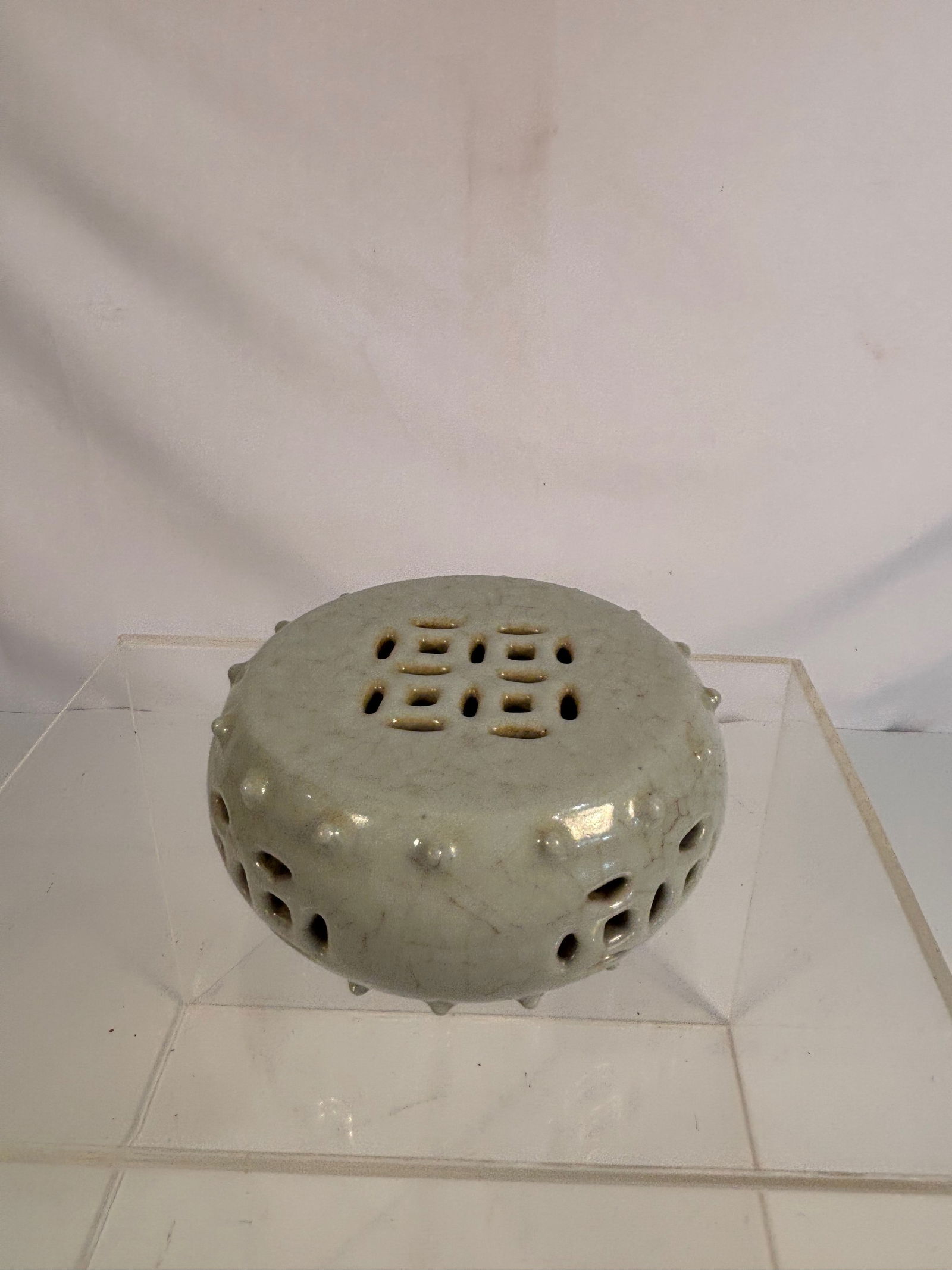 A Chinese Celadon-Glazed Pierced Incense Burner, Ge-Type Crackle, with Qianlong Mark (1 of 12)