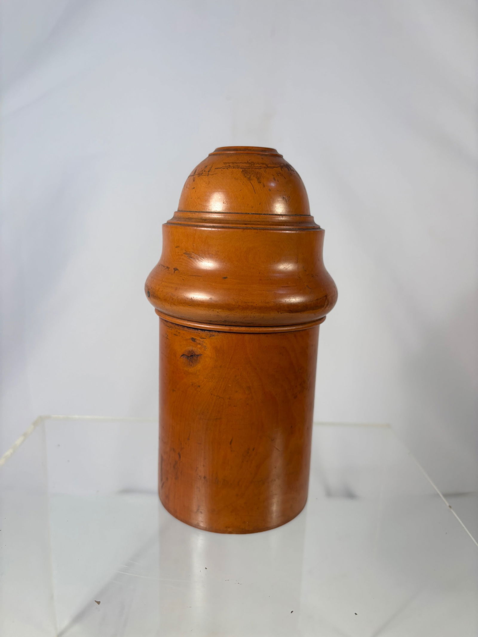 A Fine Boxwood Travelling Medicine Bottle , London , 19th Century: Turned boxwood cylindrical case with domed lid and screw-off base revealing a pill compartment, the base impressed “....... LONDON” with crown mark.?Dimensions?Height: 4.75 inches; Diameter: 3