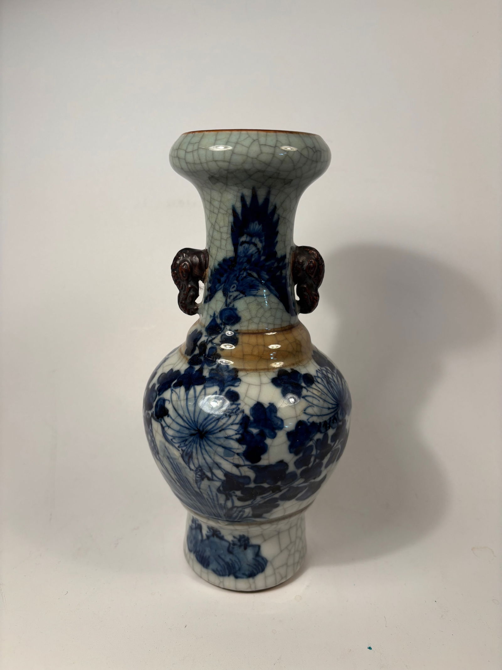 A Chinese crackle-glazed vase with underglaze blue floral decoration (1 of 8)