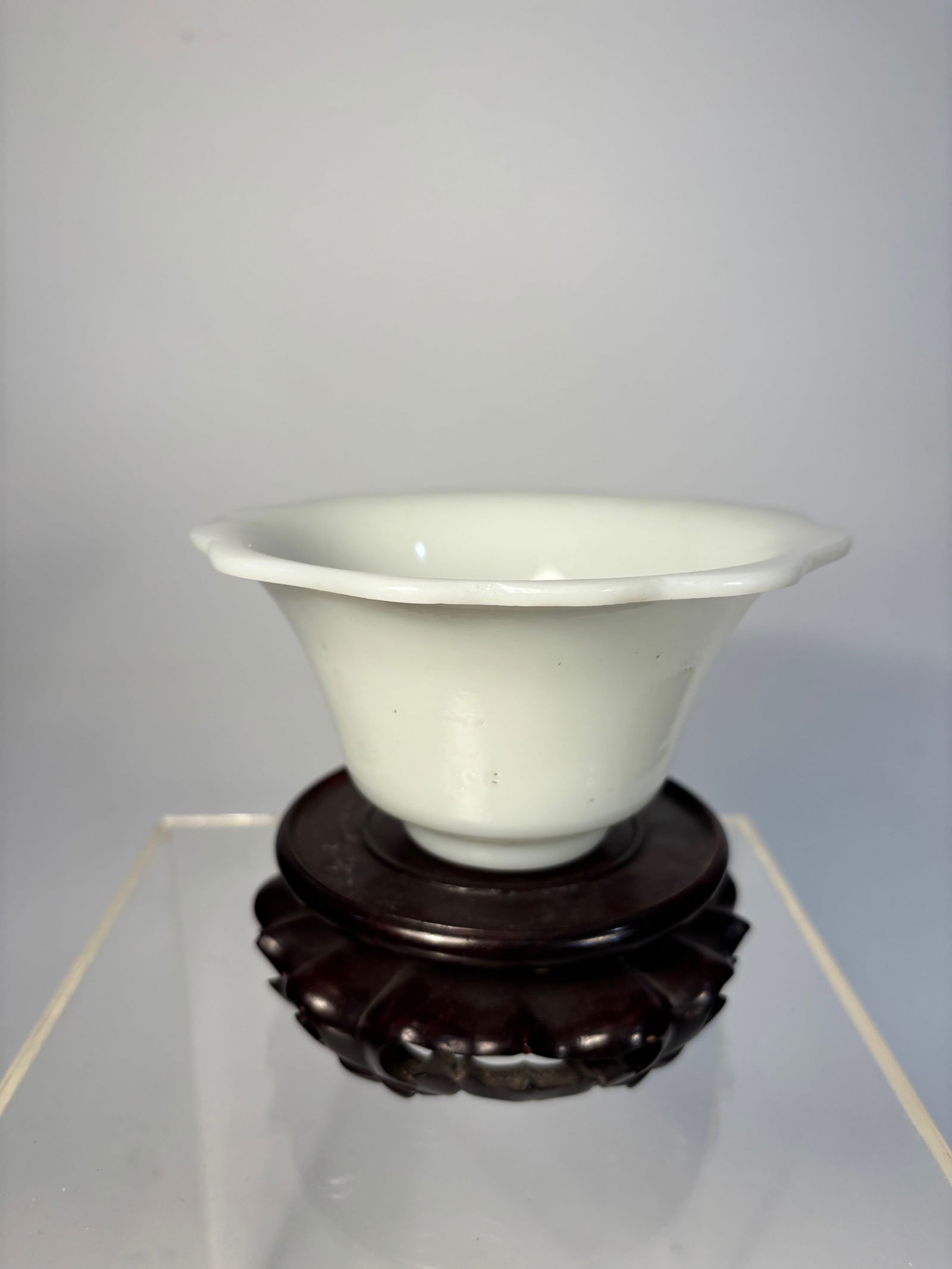 A Chinese Peking Glass Bowl – White Jade Imitation, carved "MADE IN CHINA": Qing Dynasty(1644-1912); A refined Chinese Peking glass bowl in translucent milky white glass, crafted in imitation of white jade. The vessel features a graceful trumpet-shaped body with gently scallo